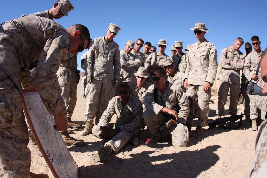 1st Lt. Adam Felde, the Weapons Platoon commander with Company K, 3rd Battalion, 8th Marine Regiment, briefs his Marines prior to entering a mock Afghan town for a patrolling mission as part of an Afghanistan-centered Mojave Viper at Range 215 Sept. 20.