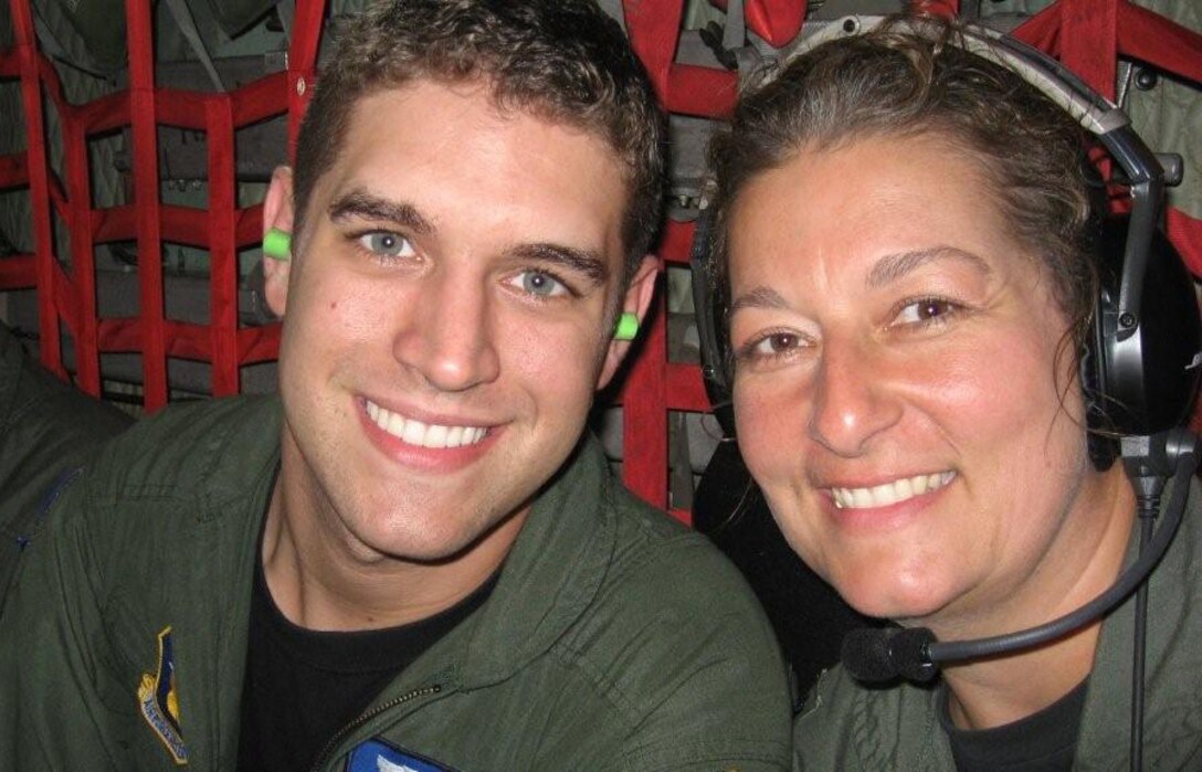 932nd Airlift Wing members smile during a time of helping others as patients awaited transport after Hurricane Gustav hit southern Louisiana in late August 2008.  Staff Sgt. David Counts and Lt. Col. Melanie Jescavage were trained and prepared to fly and help fellow Americans.  Photo submitted.