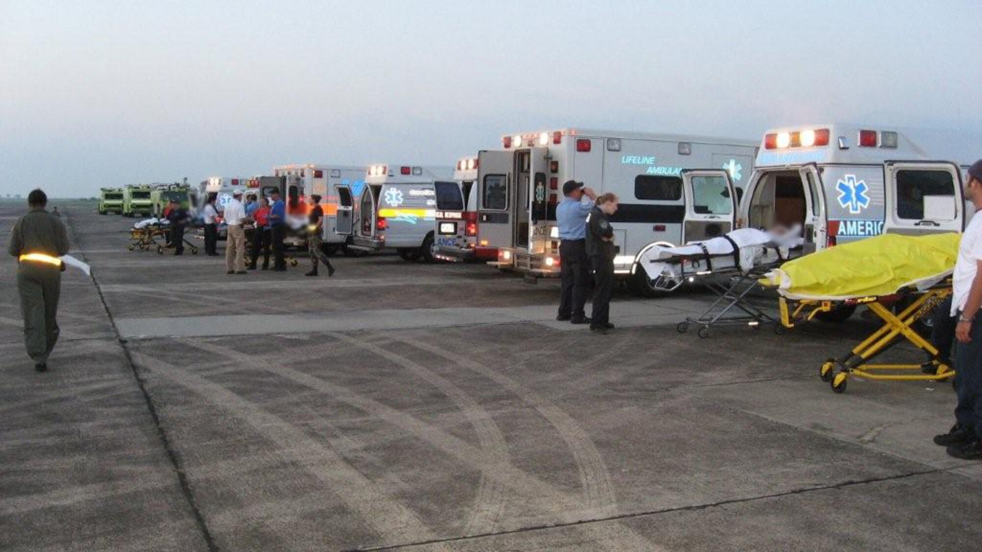 Patients await transport after Hurricane Gustav hit 
southern Louisiana as Staff Sgt. David Counts and Lt. Col. 
Melanie Jescavage prepared to fly.  Photo submitted.