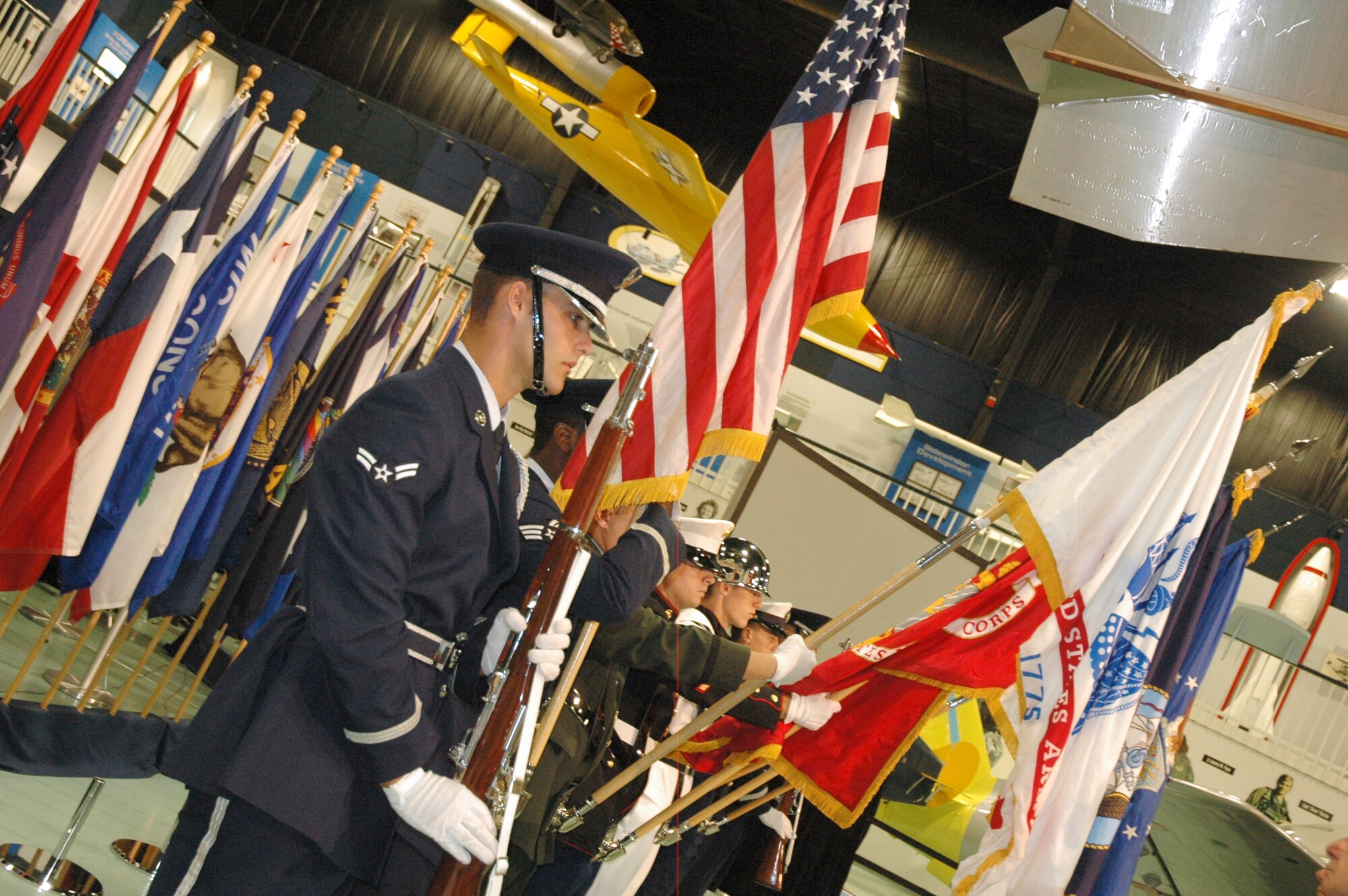 EGLIN AIR FORCE BASE, Fla. -- Members of the All Service Color Guard present the Colors at thePOW/MIA Ceremony Sept. 19 at the Air Force Armament Museum. This year's ceremony marked the seventh year Team Eglin has hosted the event to honor the sacrifices servicemembers have given and endured in the name of defending the United States of America. (U.S. Air Force photo/Staff Sgt. Stacia Zachary)
