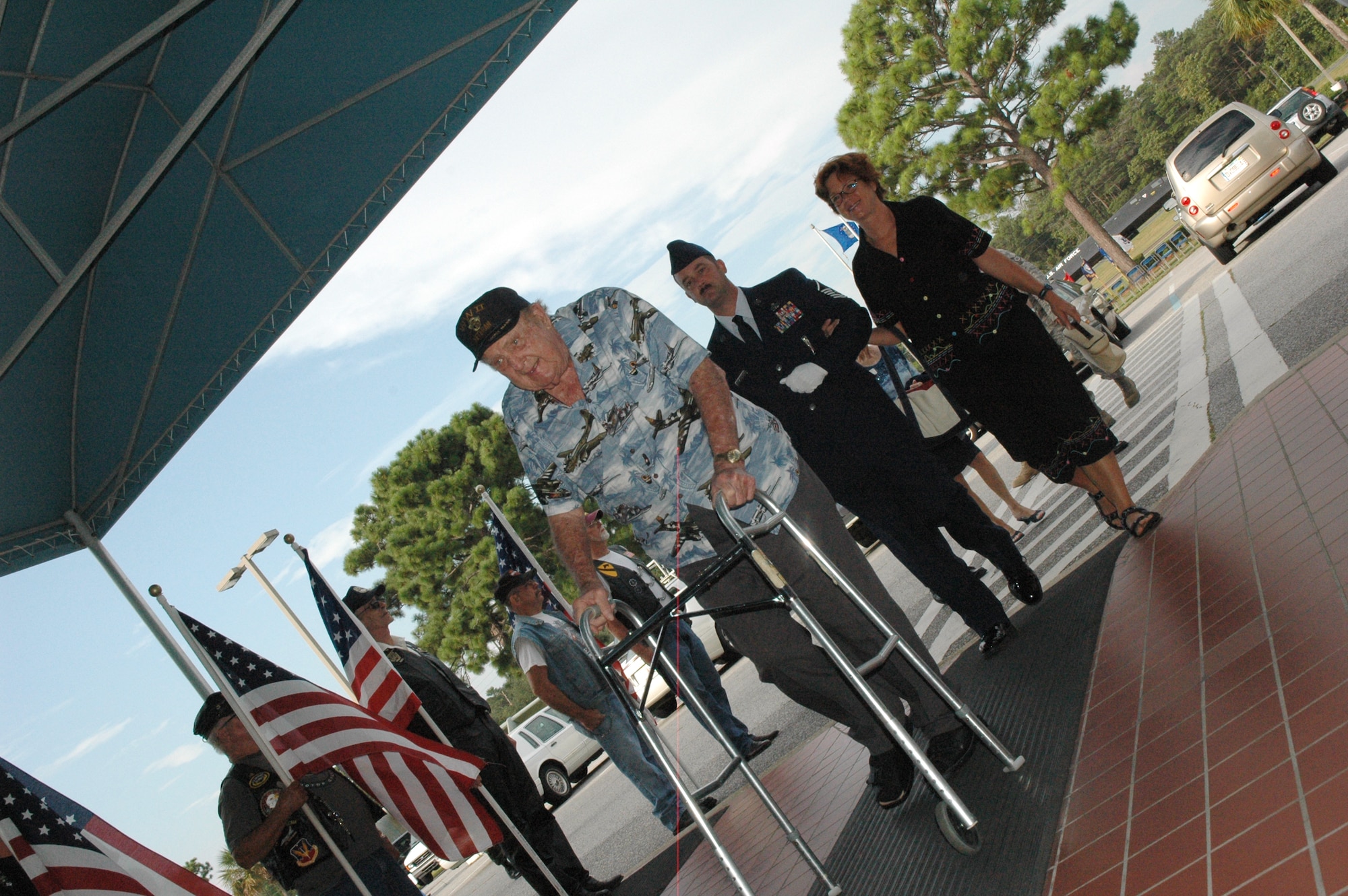 EGLIN AIR FORCE BASE, Fla. -- (Ret.) Col. Robert Gates, a Veteran of World War II, Korea and Vietnam, attends the the POW/MIA Ceremony Sept. 19 at the Air Force Armament Museum. Colonel Gates was escorted by his daughter, Aimee Shaffer, and Master Sgt. Craig Sargent, 46th Maintenance Squadron. This year's ceremony marked the seventh year Team Eglin has hosted the event to honor the sacrifices servicemembers have given and endured in the name of defending the United States of America. (U.S. Air Force photo/Staff Sgt. Stacia Zachary)
