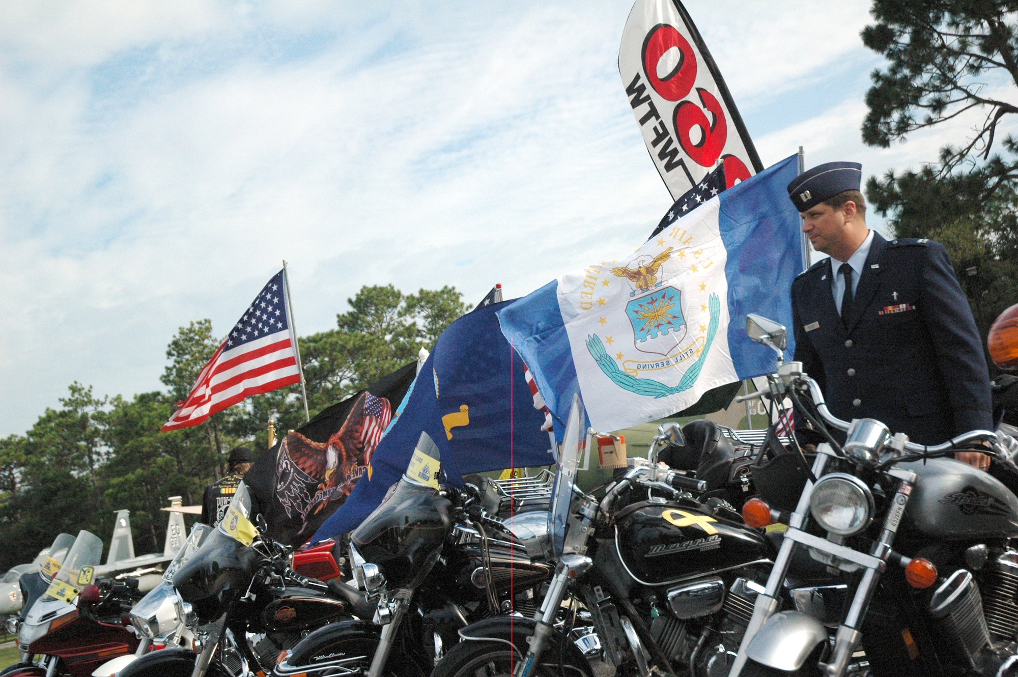 EGLIN AIR FORCE BASE, Fla. -- Chap. (Capt.) Christopher Reeder, 96th Air Base Wing chaplain, parks his bike among those of the Patriot Guard at the POW/MIA Ceremony Sept. 19 at the Air Force Armament Museum. Chaplain Reeder gave the invocation at the ceremony which also marked the seventh year Team Eglin has hosted the event to honor the sacrifices servicemembers have given and endured in the name of defending the United States of America. (U.S. Air Force photo/Staff Sgt. Stacia Zachary)