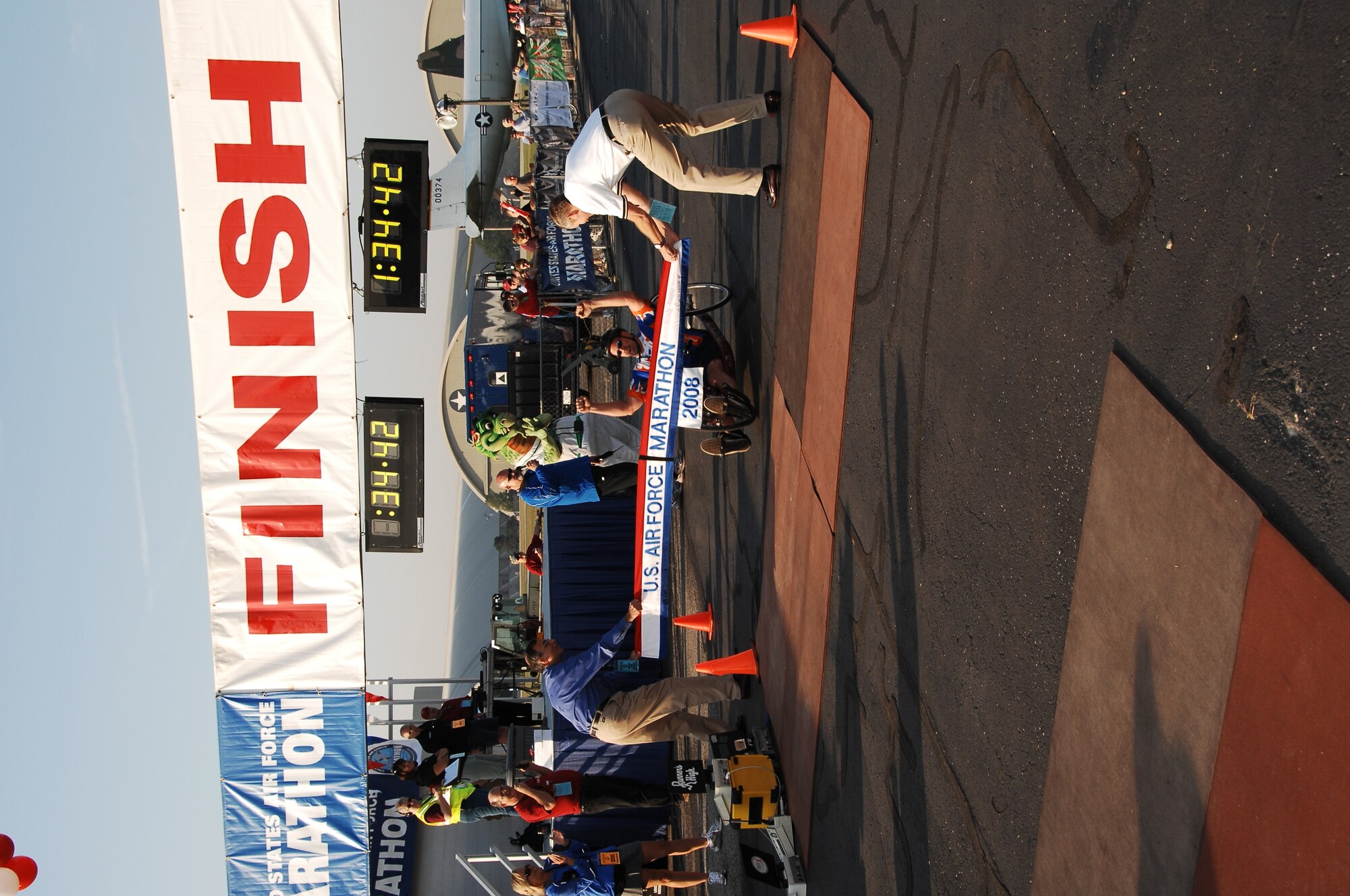 Glen Ashlock of Brooklyn, Mich., crosses the finish line capturing first place in the Full Marathon, Wheeled Division. A record field of nearly 7,400 runners participated in the 12th Annual U.S. Air Force Marathon at Wright-Patterson AFB, Ohio. (U.S. Air Force photo/Ben Strasser) 