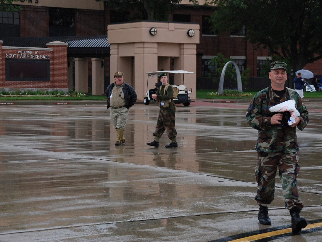 932nd Airlift Wing participated in the Airshow 2008 at Scott Air Force Base, Ill.  Public affairs specialist Tech. Sgt. Gerald Sonnenberg at right, gives a short tour to two World War II "actors" displaying vintage vehicles and weapons, part of the Second Ranger Batallion. They were at the Scott Air Force Base AIRSHOW 2008. (U.S. Air Force photo by Maj. Stan Paregien)