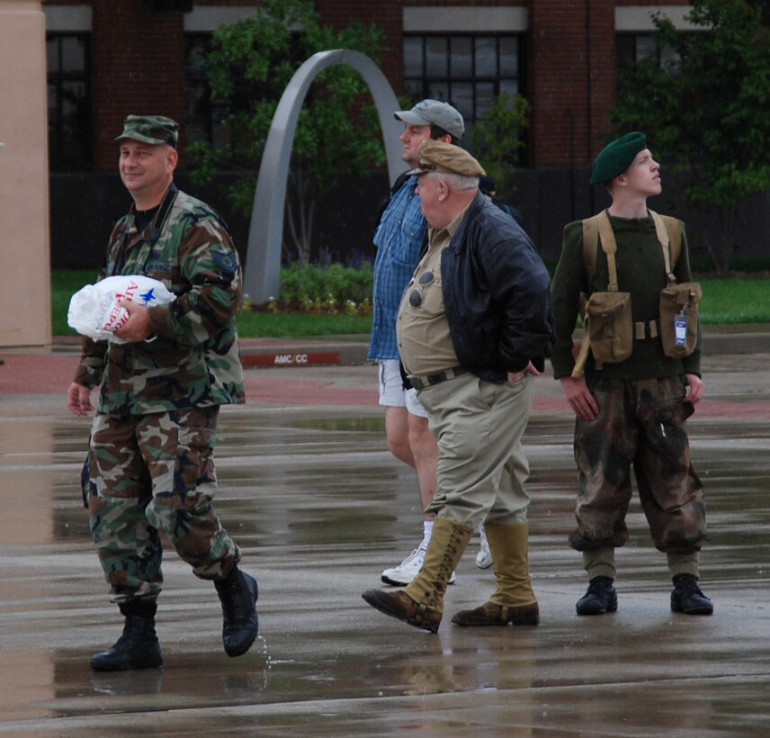 932nd Airlift Wing participated in the Airshow 2008 at Scott Air Force Base, Ill. Public affairs specialist Tech. Sgt. Gerald Sonnenberg shows visitors the way around, including two World War II "actors" displaying vintage vehicles and weapons, part of the Second Ranger Batallion. They were at the Scott Air Force Base AIRSHOW 2008. (U.S. Air Force photo by Maj. Stan Paregien)