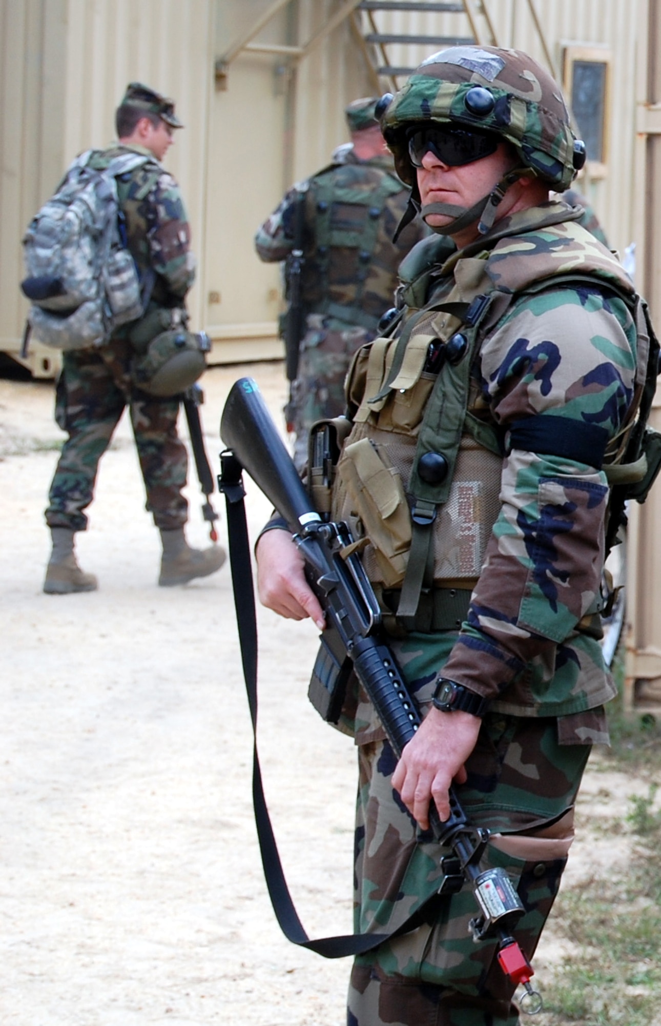 First Lt. William Newby, from the 95th Communications Group, Edwards Air Force Base, Calif., keeps watch in the fictional village of Citheron during a scenario for Air Force Exercise Eagle Flag 08-6 Sept. 19, 2008, at Naval Air Engineering Station Lakehurst, N.J.  The exercise, managed by the U.S. Air Force Expeditionary Center's 421st Combat Training Squadron from Fort Dix, N.J., tests and trains more than 400 Airmen in expeditionary combat support skills.  (U.S. Air Force Photo/Tech. Sgt. Scott T. Sturkol)