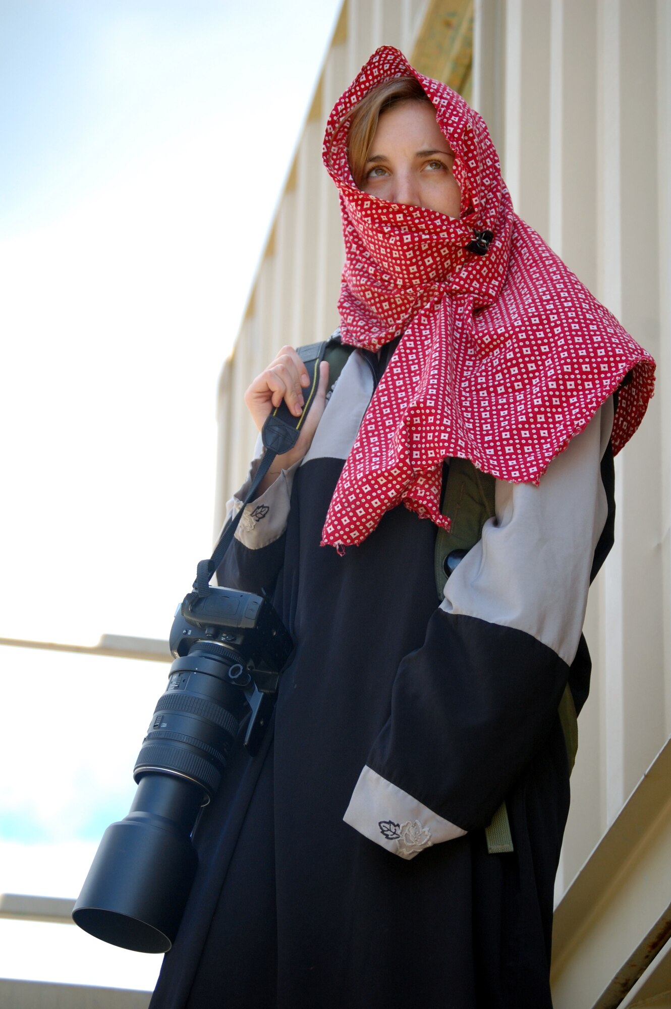 Airman 1st Class Rachel Kocin, a photographer from the 49th Fighter Wing public affairs office at Hollomon Air Force Base, N.M., waits for a scenario to start during operations for Air Force Exercise Eagle Flag 08-6 Sept. 19, 2008, at Naval Air Engineering Station Lakehurst, N.J.  Airman Kocin was one of four media role players for the exercise. The exercise, managed by the U.S. Air Force Expeditionary Center's 421st Combat Training Squadron from Fort Dix, N.J., tests and trains more than 400 Airmen in expeditionary combat support skills.  (U.S. Air Force Photo/Tech. Sgt. Scott T. Sturkol)