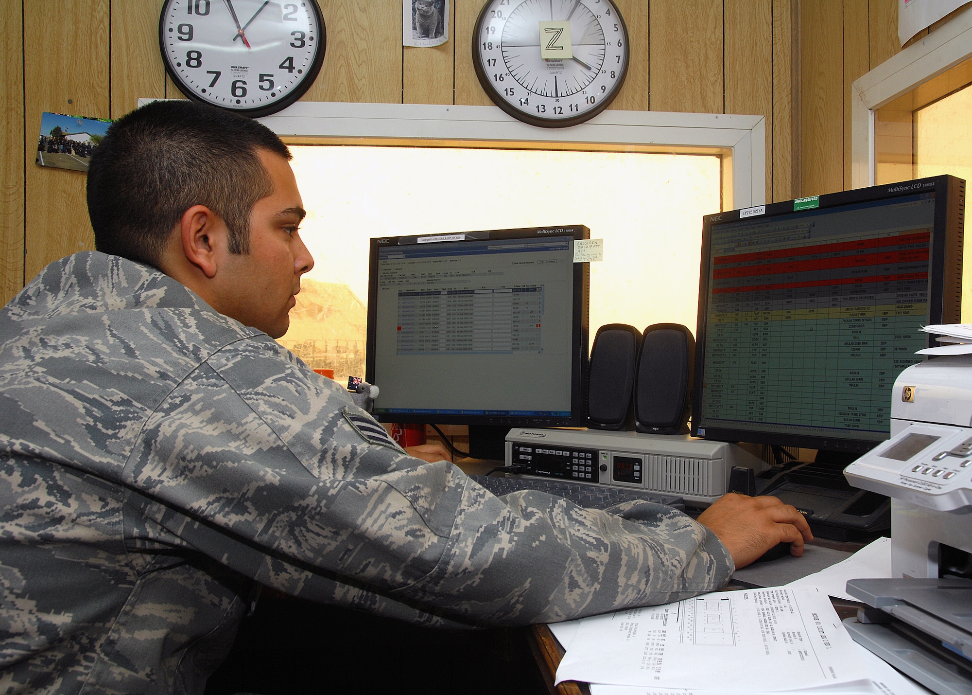 SOUTHWEST ASIA -- Senior Airman Jason Radach, assigned to the 386th Expeditionary Logistics Readiness Squadron Aerial Port section, checks the passenger and cargo information on an incoming flight on Sept. 9 at an air base in Southwest Asia. Aerial port Airmen recently completed a "back to the basics" course focusing on safety and key aspects of their workcenter duties and responsibilities. The section is responsible for passenger and cargo movement of aircraft operating throughout the U.S. Central Command area of responsibility. The section has moved more than 400,000 passengers and 63,000 pounds of cargo to date. Airman Radach is deployed from Travis Air Force Base, Calif. (U.S. Air Force photo/Tech. Sgt. Raheem Moore) 