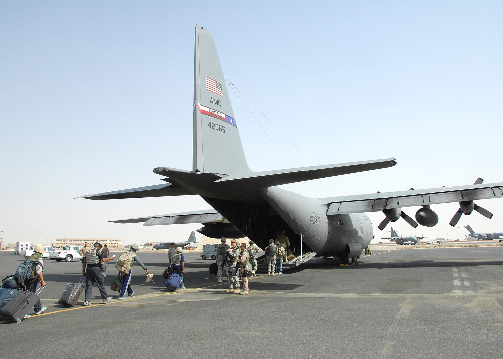 SOUTHWEST ASIA -- The 386th Expeditionary Logistics Readiness Squadron Aerial Port section boards passengers on a C-130 Hercules bound for Iraq on Aug. 20 at an air base in Southwest Asia. Aerial port Airmen recently completed a "back to the basics" course focusing on safety and key aspects of their workcenter duties and responsibilities. The section is responsible for passenger and cargo movement of aircraft operating throughout the U.S. Central Command area of responsibility. The section has moved more than 400,000 passengers and 63,000 pounds of cargo to date. (U.S. Air Force photo/Tech. Sgt. Raheem Moore)