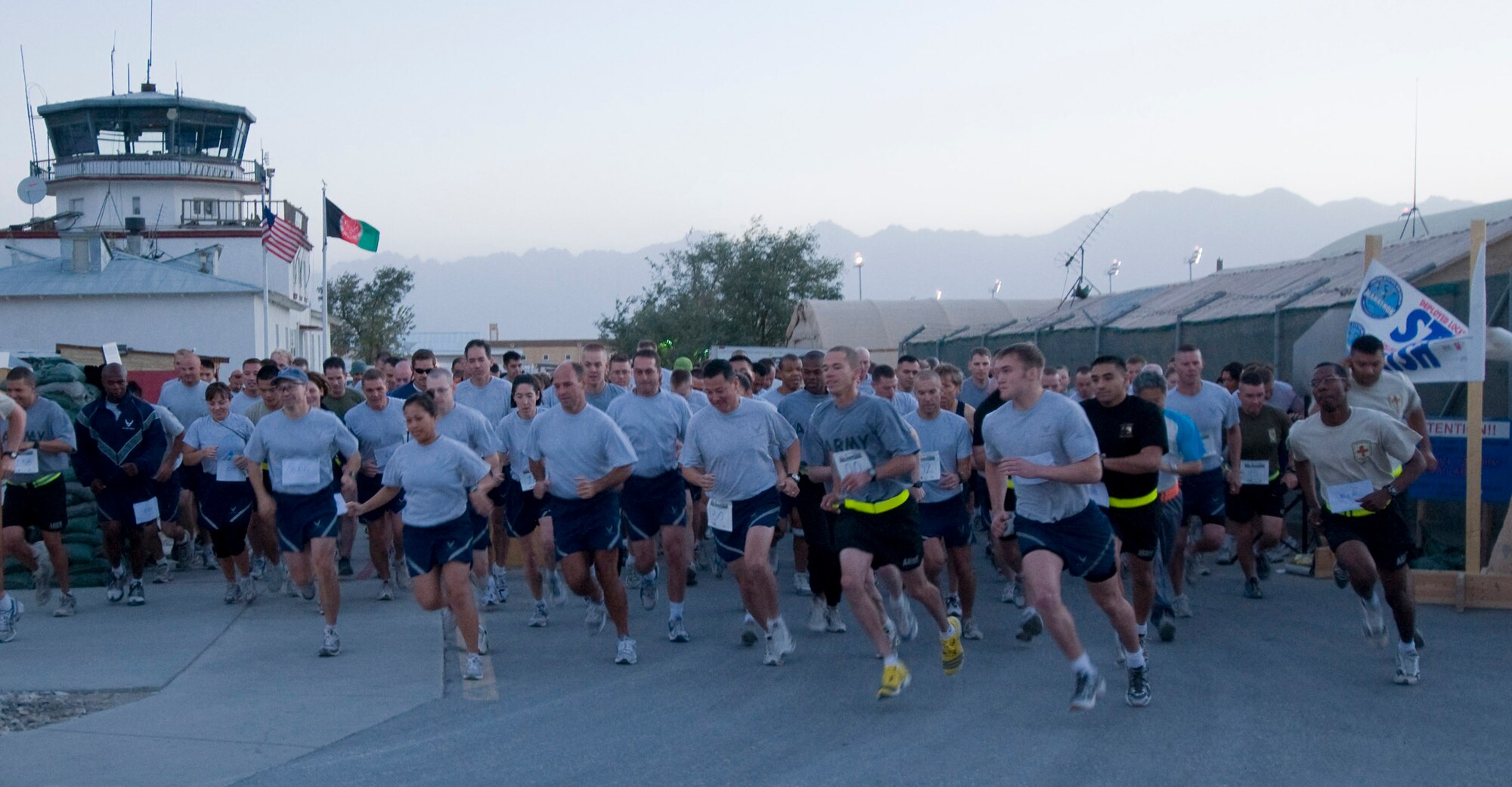 BAGRAM AIR FIELD, Afghanistan -- Runners begin the 5 kilometer run here September 20, 2008. The run allowed deployed coalition members to be a part the 32nd Annual Air Force Marathon. (U.S. Air Force photo by Staff Sgt. Samuel Morse/Released)