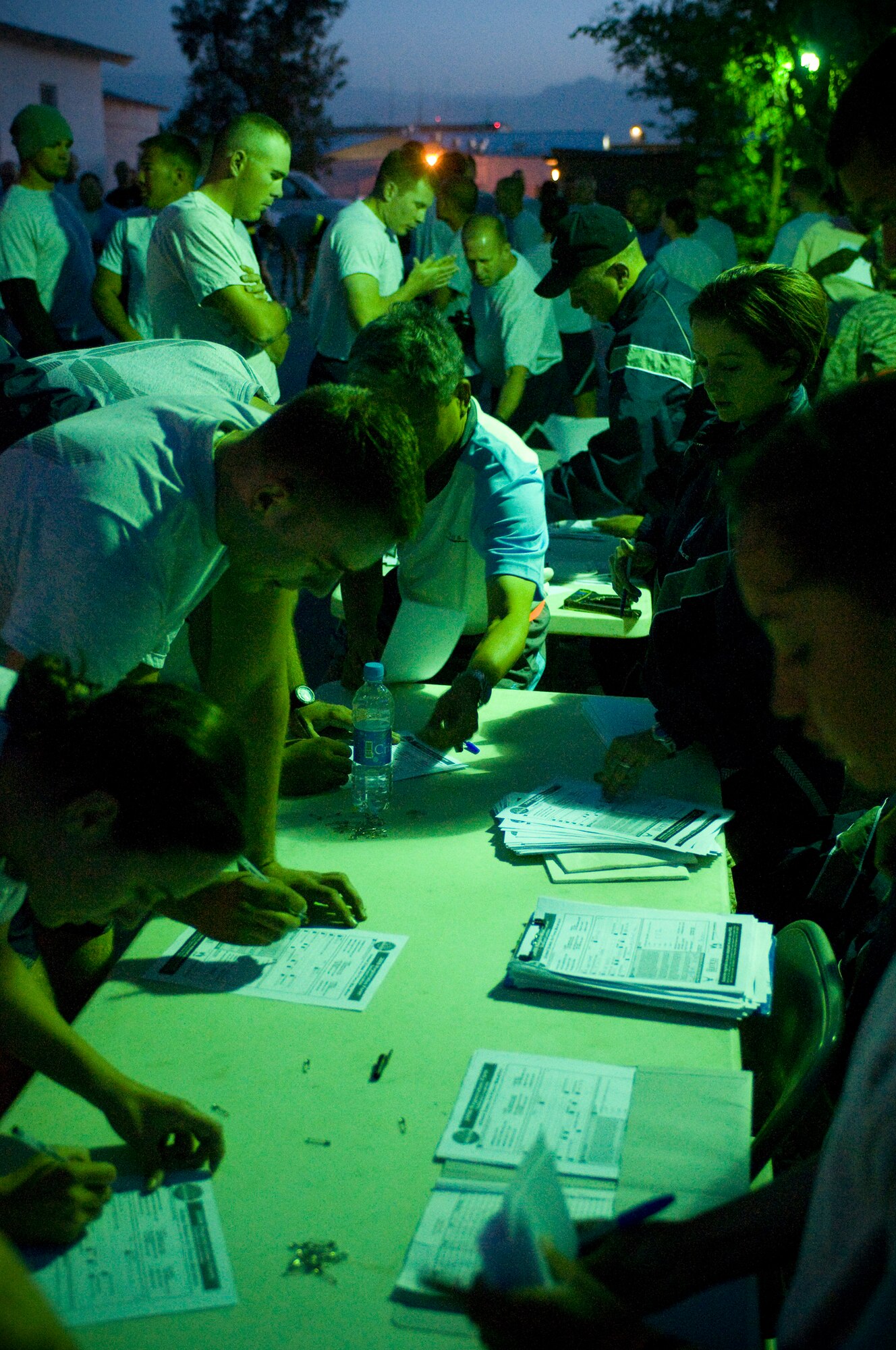 BAGRAM AIR FIELD, Afghanistan -- Runners register for the Air Force Marathon 5K Run here September 20, 2008. Runners lined up long before dawn to register for the race commemorating the Air Force Marathon taking place later that day at Wright-Patterson Air Force Base, Dayton, Ohio. (U.S. Air Force photo by Staff Sgt. Samuel Morse/Released)