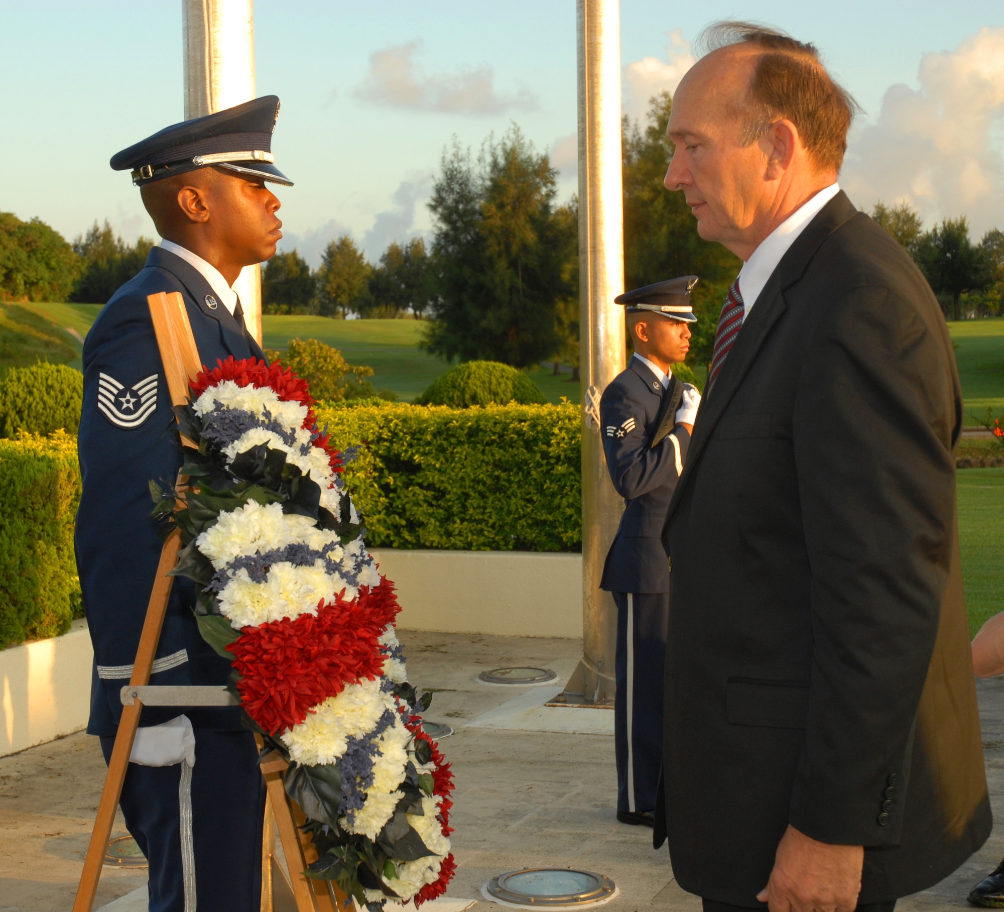 Retired U.S. Air Force Capt. Guy Gruters admires the ceremonial wreath during the annual POW/MIA Memorial Ceremony at Kadena Air Base, Japan Sept. 19, 2008. Gruters was held captive for over five years during the Vietnam War after his F100-F was shot down over North Vietnam in 1967. (U.S. Air Force photo/Airman 1st Class Chad Warren)