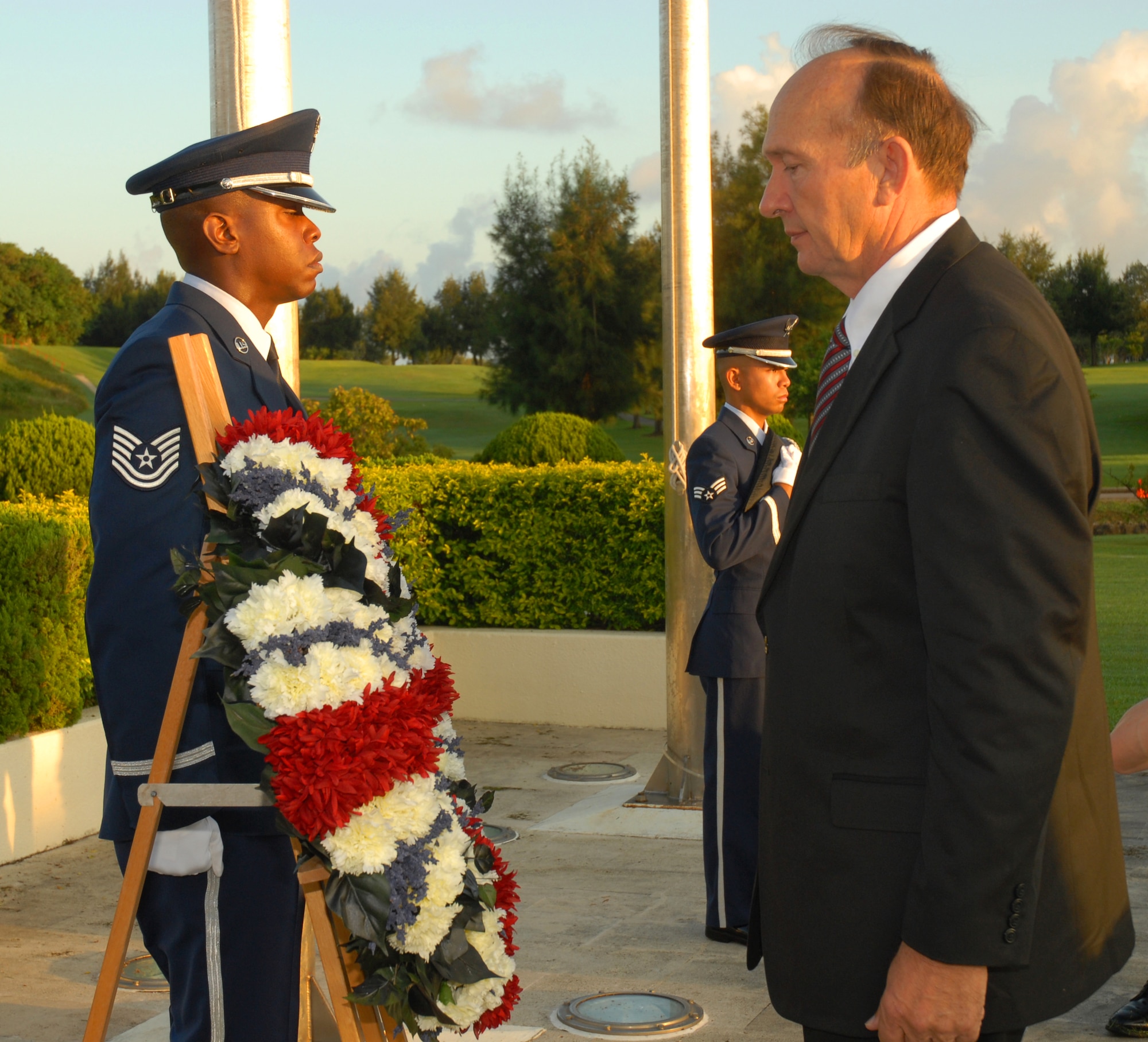 Retired U.S. Air Force Capt. Guy Gruters admires the ceremonial wreath during the annual POW/MIA Memorial Ceremony at Kadena Air Base, Japan Sept. 19, 2008. Gruters was held captive for over five years during the Vietnam War after his F100-F was shot down over North Vietnam in 1967. (U.S. Air Force photo/Airman 1st Class Chad Warren)