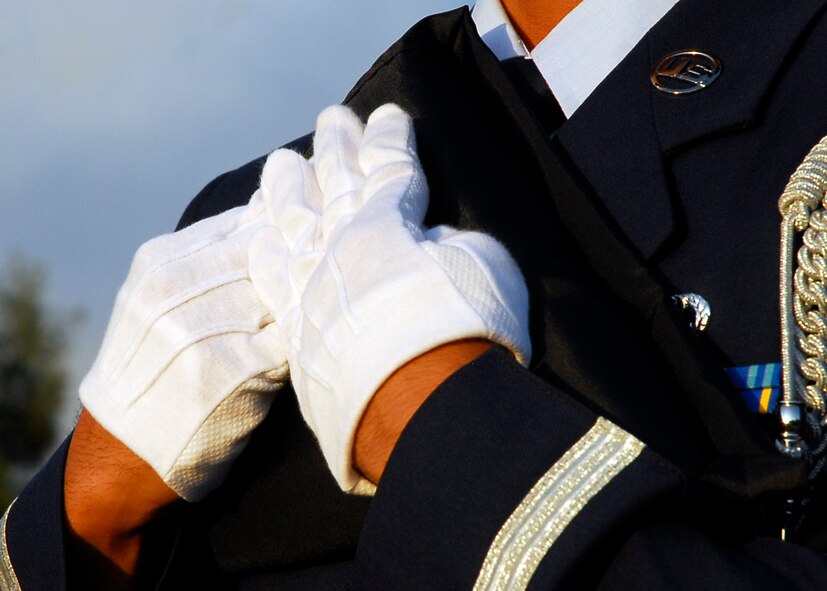 Senior Airman Marlon Quitos from the Kadena Air Base Honor Guard holds the POW/MIA flag during the base’s annual POW/MIA Remembrance Ceremony Sept. 19, 2008. Kadena hosts a remembrance ceremony each year in honor of all POW/MIA service members past and present. (U.S. Air Force photo/Airman 1st Class Amanda Grabiec)