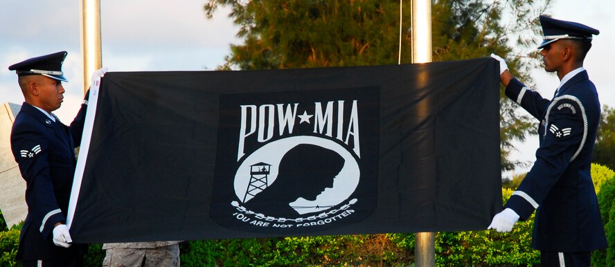 Senior Airmen Marlon Quitos and Aman Prasad from the Kadena Air Base Honor Guard fold the POW/MIA flag Sept. 19, 2008 during the base’s annual POW/MIA Remembrance Ceremony. Kadena hosts a remembrance ceremony each year in honor of all POW/MIA service members past and present. (U.S. Air Force photo/Airman 1st Class Amanda Grabiec)