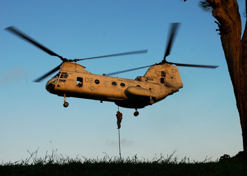 Members of the 31st Rescue Squadron rappel out of a U.S. Marine Corps CH-46 Sea Knight to deliver the POW/MIA flag at Kadena Air Base’s annual POW/MIA Remembrance Ceremony Sept. 19, 2008.  Kadena hosts a remembrance ceremony each year in honor of all POW/MIA service members past and present. (U.S. Air Force photo/Airman 1st Class Amanda Grabiec)