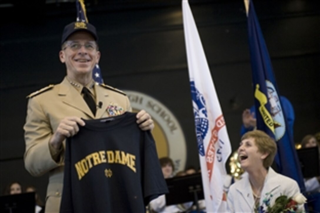 Navy Adm. Mike Mullen, chairman of the Joint Chiefs of Staff, receives a Notre Dame High School alumni cap and T-shirt after speaking to students, faculty and parents at his high school alma mater, Notre Dame High School, Sherman Oaks, Calif., Sept. 19, 2008. 