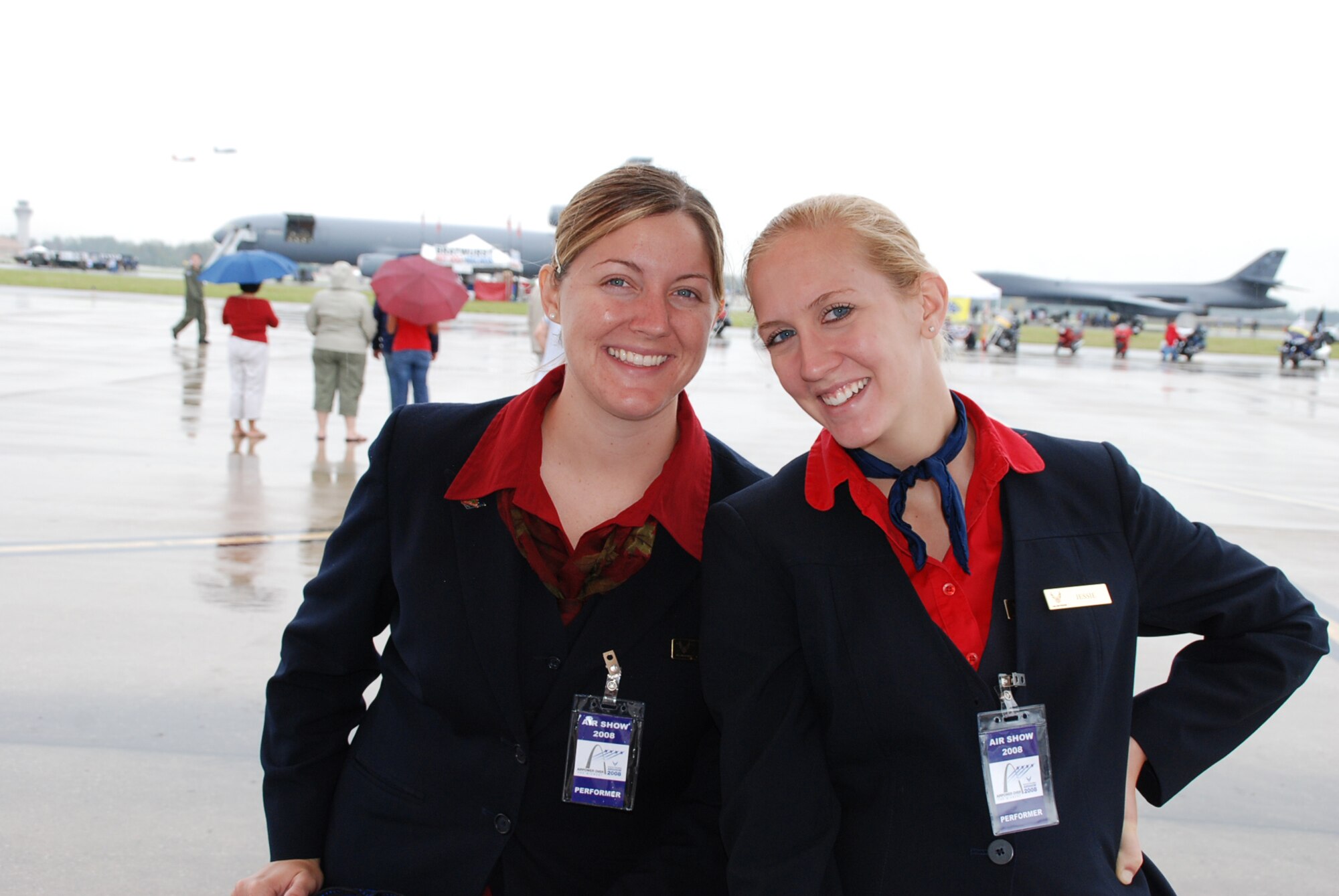 932nd Airlift Wing distinguished visitor flight attendants "Liz" and "Jessie" braved the rain to visit with the general public at the Scott Airshow 2008.  (U.S. Air Force by Tech. Sgt. Gerald Sonnenberg)