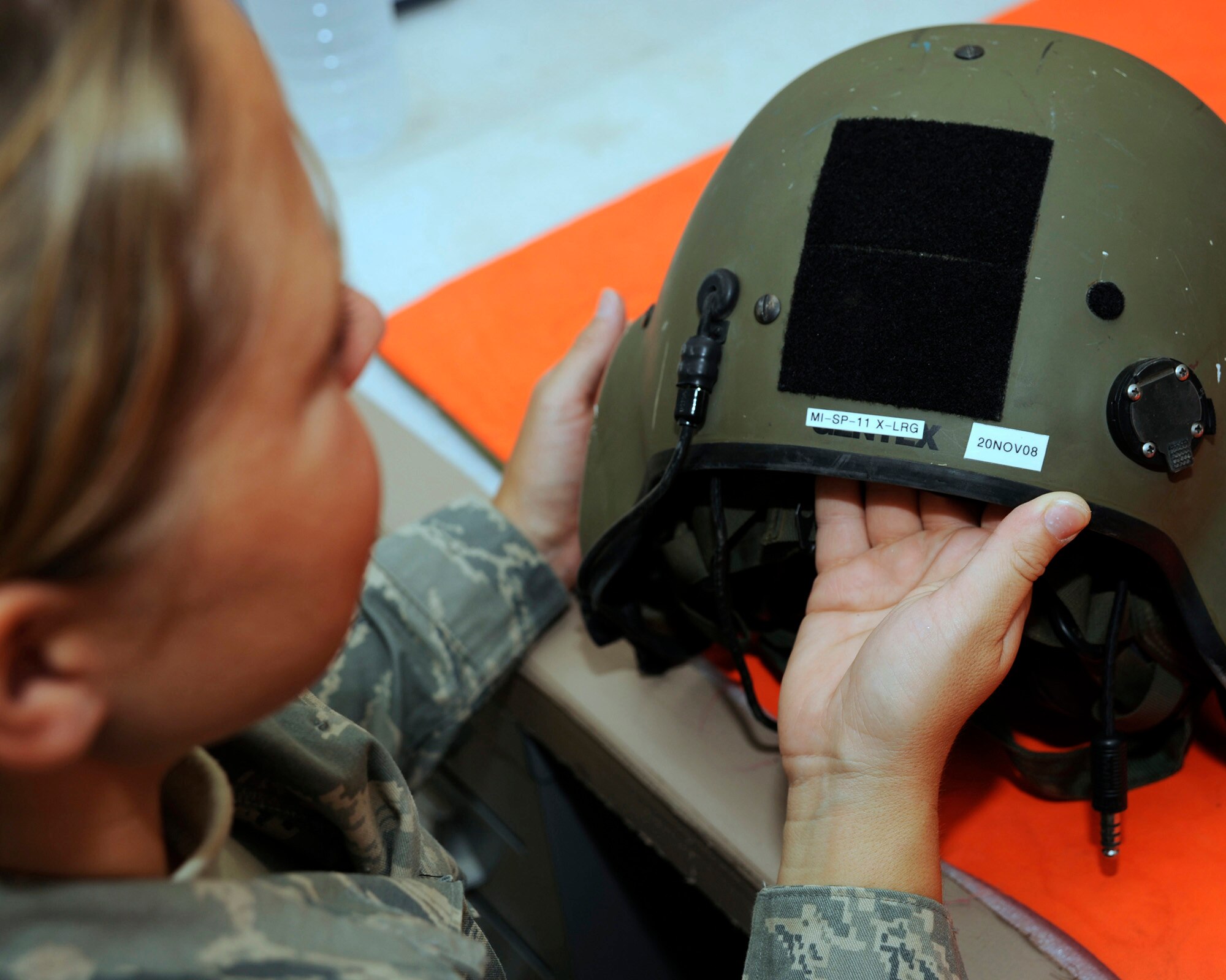 U.S. Air Force Tech. Sgt. Shaun Cox, aircrew flight equipment combat air advisor with the 770th Air Expeditionary Advisory Squadron, documents the next inspection date for an aircrew helmet at Al Taji Air Base, Iraq on Sept. 11, 2008. Cox, a Lincoln, Neb. native, ensures reliability of all life support equipment such as survival vests, helmets, body armor, and gunner belts for U.S. and Iraqi aircrews. (U.S. Air Force photo/Staff Sgt. Paul Villanueva II/Released)
