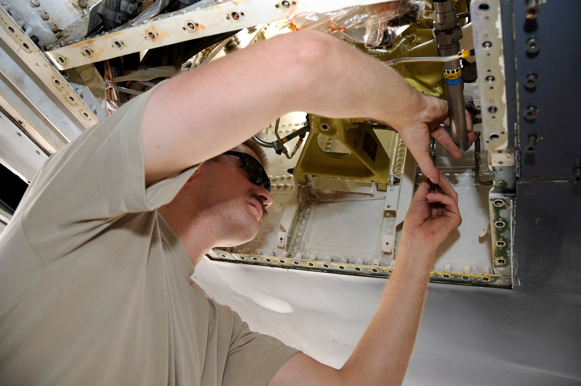 Tech. Sgt. Neil Cook, 379th Expeditionary Aircraft Maintenance Squadron, 34th Aircraft Maintenance Unit, uses calipers to check tolerance on a control valve Sept. 19, 2008.  The tolerance adjustment on the control valve is tight, at 3/1000 of an inch, when changing the wing sweep gear sub-assembly on the B-1 Lancer here at this undisclosed location in Southwest Asia.  The B-1 is the backbone of America's long-range bomber force. It can rapidly deliver massive quantities of precision and non-precision weapons against any adversary, anywhere in the world, at any time.  Sergeant Cook is a native of Rapid City, S.D., and deployed from Ellsworth Air Force Base, S. D., in support of Operations Iraqi and Enduring Freedom and Joint Task Force-Horn of Africa.  (U.S. Air Force photo by Tech. Sgt. Michael Boquette/Released)