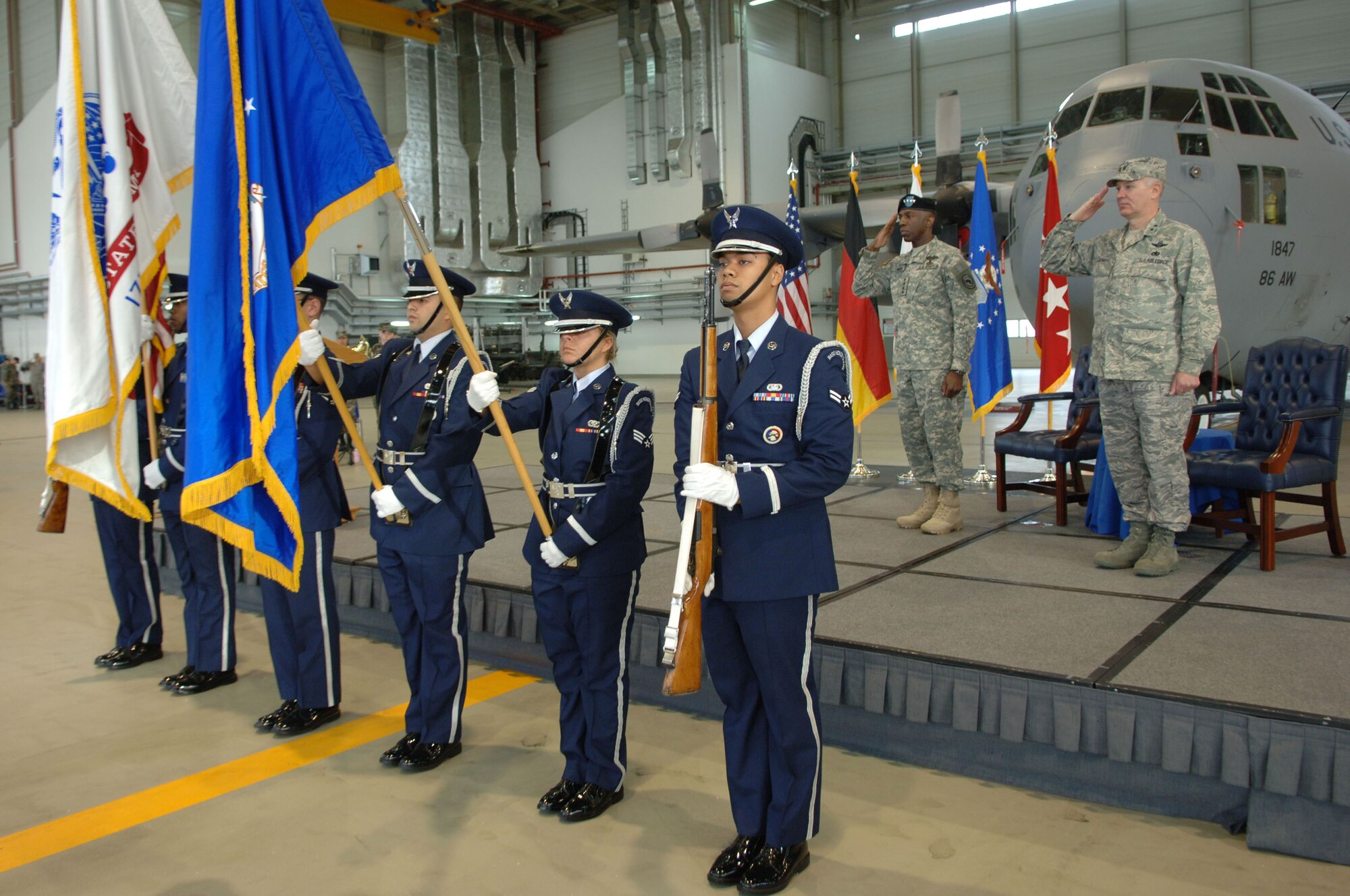U.S. African Command Commander Army Gen. William E. "Kip" Ward (left) and Air Force Maj. Gen. Ronald R. Ladnier, commander of Seventeenth Air Force, salute the colors as the national anthem is sung during an assumption of command ceremony Sept. 18 at Ramstein Air base, Germany. General Ladnier took the guidon for Seventeenth Air Force, which officially activates Oct. 1 and will serve as the air component for U.S. (U.S. Air Force photo by Airman 1st Class Tony R. Ritter)(Released)