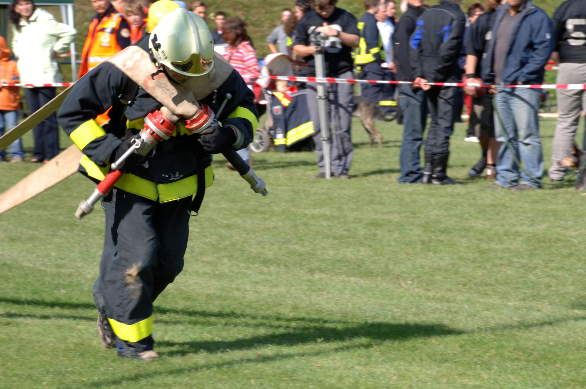 Steffen Schunck, 835th Civil Engineer Squadron Fire Department, competes in the 'hose drag' portion of the Firefighters Challenge 2008 in Buchenbeuren, Germany, Sept. 14, 2008. Firefighters from over 40 different stations came together to compete in fire protection scenarios during the challenge. (U.S. Air Force photo by Airman 1st Class Tony Ritter)(Released)