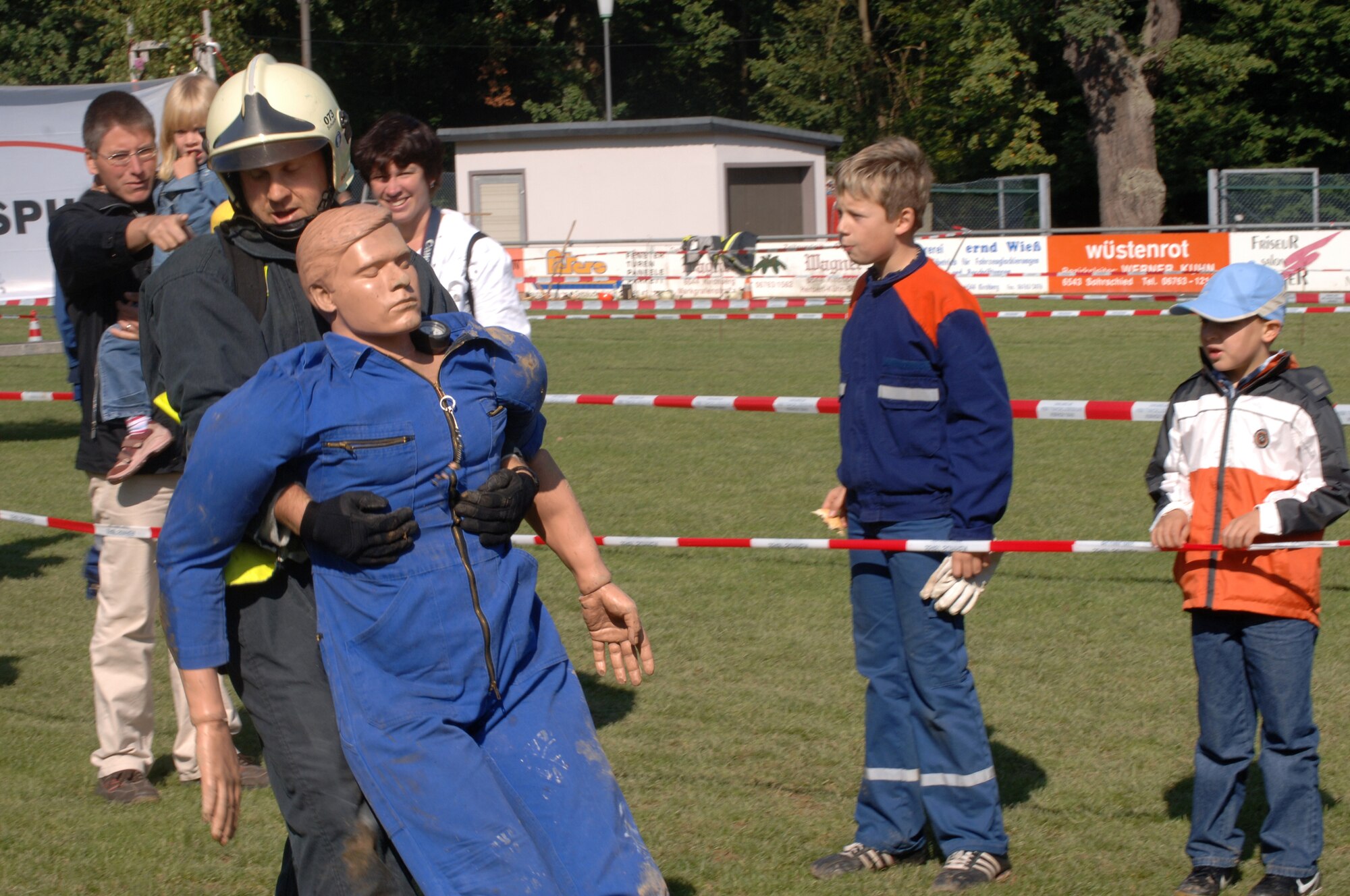 Steffen Schunck, 835th Civil Engineer Squadron Fire Department, drags a 200 pound dummy to safety during the Firefighters Challenge 2008 in Buchenbeuren, Germany, Sept. 14, 2008. Firefighters from over 40 different stations came together to compete in fire protection scenarios during the challenge. (U.S. Air Force photo by Airman 1st Class Tony Ritter)(Released)