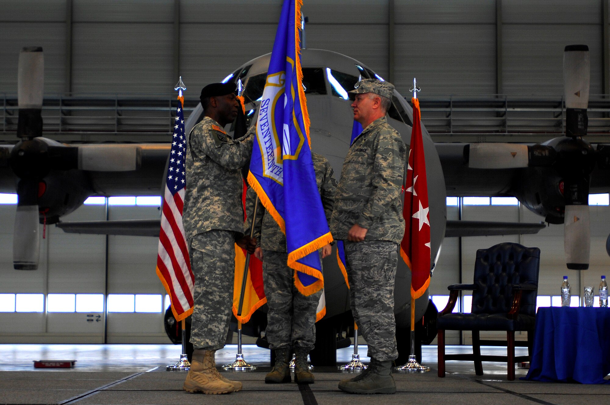 U.S. African Command Commander Army Gen. William E. "Kip" Ward (left) bestows the Seventeenth Air Force guidon to its new commander, Air Force Maj. Gen. Ronald R. Ladnier, in a Sept. 18 assumption of command ceremony at Ramstein Air Base, Germany. Seventeenth Air Force, which officially activates Oct. 1, will serve as the air component for U.S. (U.S. Air Force photo by Airman 1st Class Kenny Holston)(Released)  
