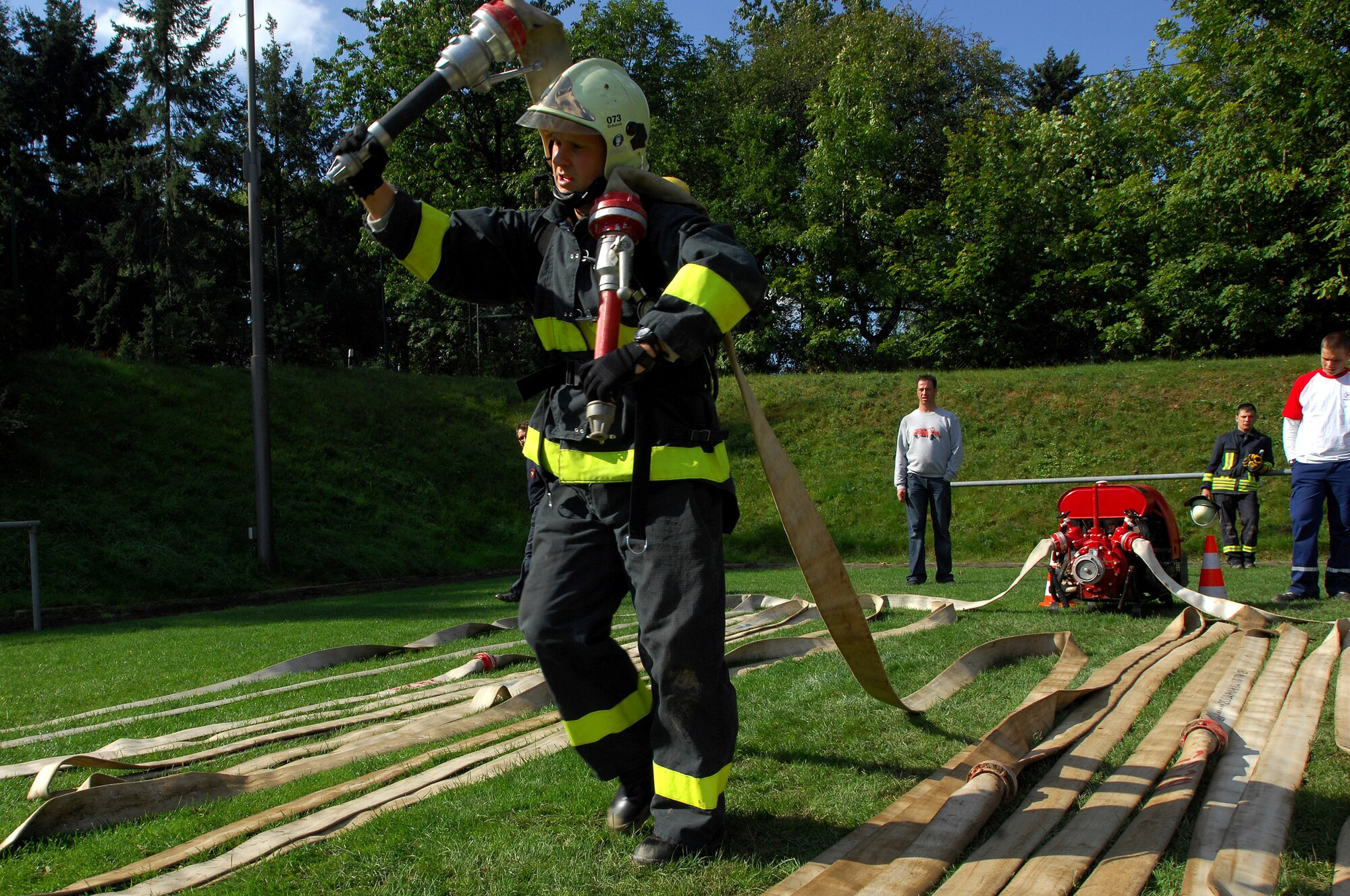 Steffen Schunck, 835th Civil Engineer Squadron Fire Department, competes in the 'hose drag' portion of the Firefighters Challenge 2008, Buchenbeuren, Germany, Sept. 14, 2008. Firefighters from over 40 different stations came together to compete in fire protection scenarios during the challenge. (U.S. Air Force photo Airman 1st Class Kenny Holston)(Released)*
