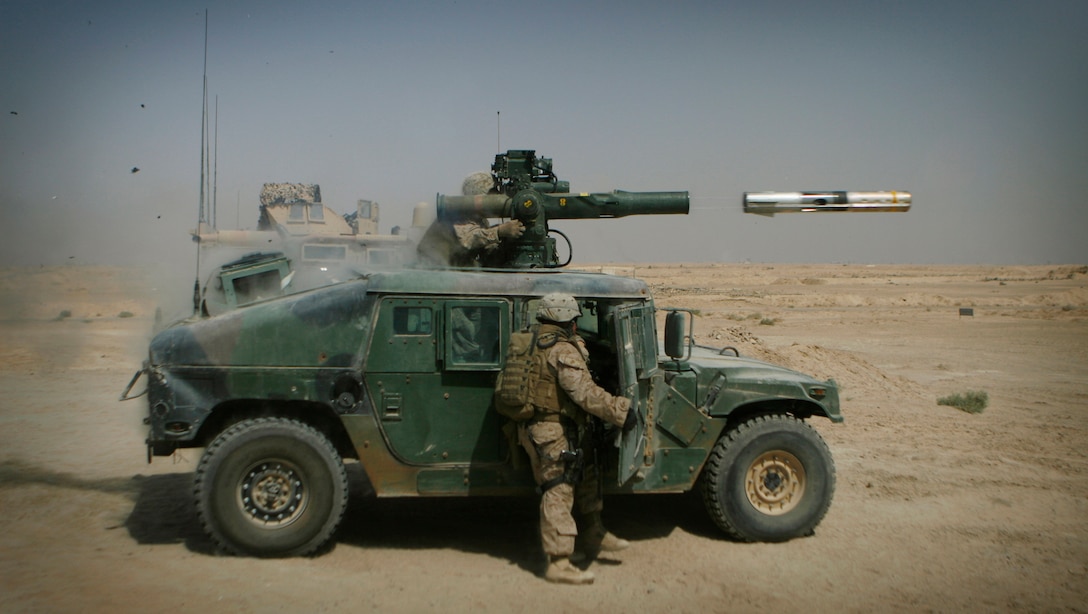 Lance Cpl. Jeffery Evans, a TOW gunner with Mobile Assault Platoon, Weapons Company, 3rd Battalion, 6th Marines, fires an M220 Tube-Launched, Optically Tracked Wire-Guided missile Sept. 21.