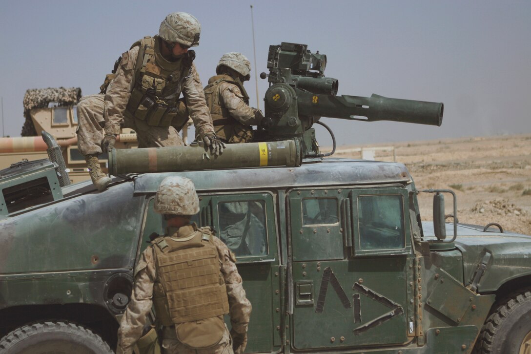 FALLUJAH, Iraq (Sept. 21, 2008) – Lance Cpl. Jeffery Evans (above), a TOW gunner with Mobile Assault Platoon, Weapons Company, 3rd Battalion, 6th Marines prepares to load an M220 Tube-Launched, Optically Tracked Wire-Guided (TOW) missile into a launcher here, Sept. 21. Bradley and other TOW gunners performed a live-fire exercise in conjunction with medium and heavy machine gun fire to hone their skills on the weapon system that they are specialized in their military occupational specialty (MOS). (Official U.S. Marine Corps photo by Cpl. Chris Lyttle) (RELEASED)