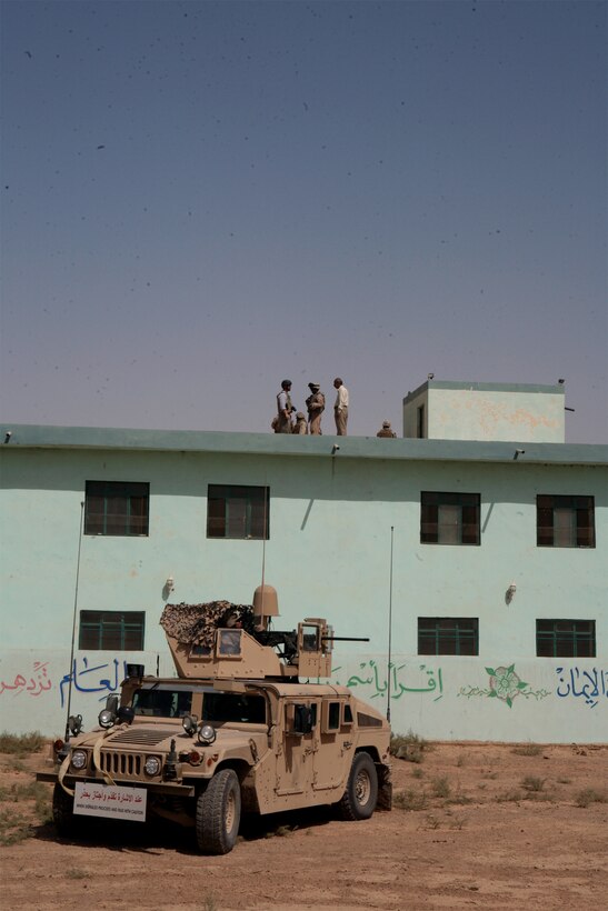 SAQLAWAIYAH, Iraq (September 21, 2008) – Marines with, Civil Affairs, Detachment 3, Team 4, attached to Task Force 1st Battalion, 2nd Marine Regiment, Regimental Combat Team 1, inspect construction work during their visit to the al Iqitdar School Sept. 21. After being destroyed by a terrorist bombing attack, the newly reconstructed school stands as a symbol of defiance against insurgent activity in the community. (Official U.S. Marine Corps photo by Lance Cpl. Scott Schmidt)