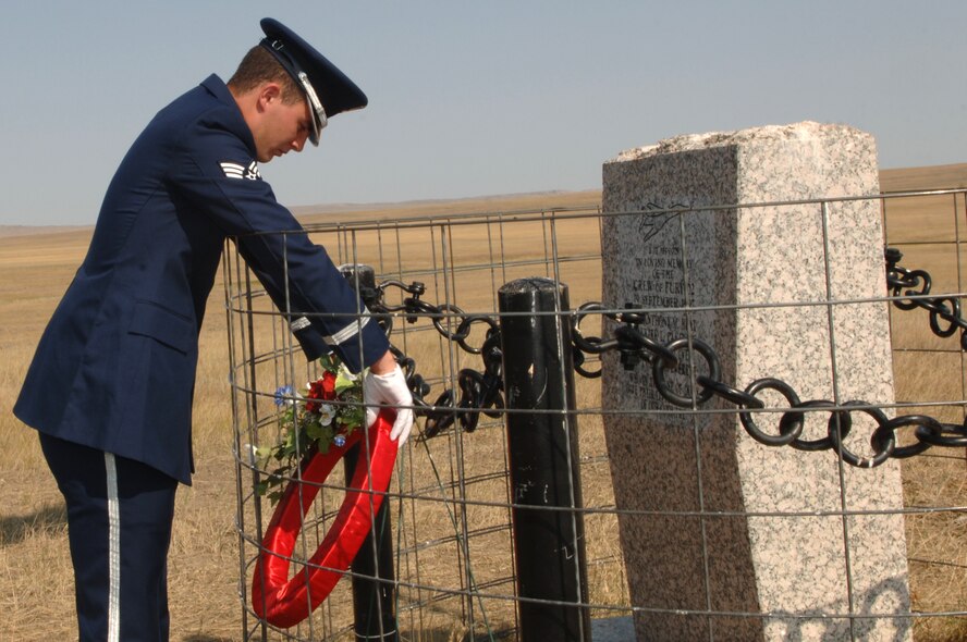Senior Airman Thomas Hienen, Ellsworth Honor Guard member, places a wreath at the Fury II Memorial in remembrance of four Airmen who lost their lives when a B-1 crashed 11 years ago. Airman Hienen was one of 10 Ellsworth Airmen who went to visit the memorial Sept. 19.
(U.S. Air Force photo/Senior Airman Kasey Zickmund)