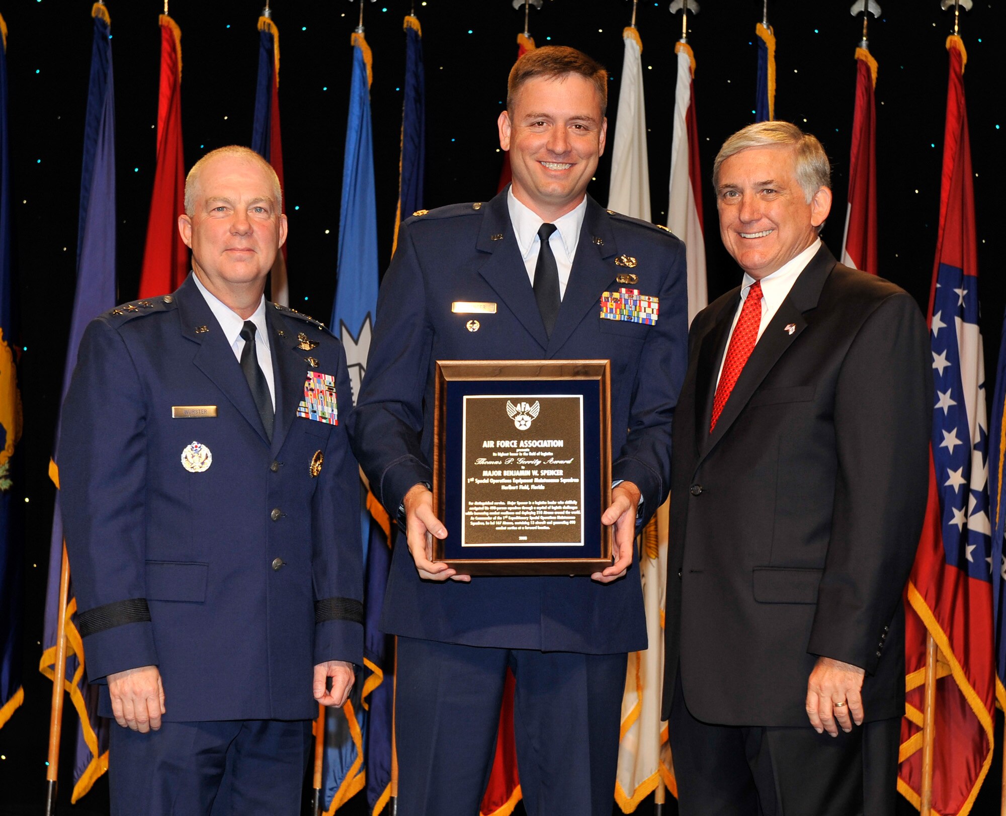 Maj. Benjamin Spencer, 1st Special Operations Equipment Maintenance Squadron commander, poses for a photo with AFSOC commander Lt. Gen. Donny Wurster (left) and AFA Chairman Robert Largent (right) after being awarded the Thomas P. Gerrity Award at the Air Force Association's 2008 Air and Space Conference and Technology Exposition in Washington, D.C. recently. The Gerrity Award recognizes the individual who made the most outstanding contribution in the field of systems and logistics (U.S. Air Force photo by Michael Pausic).