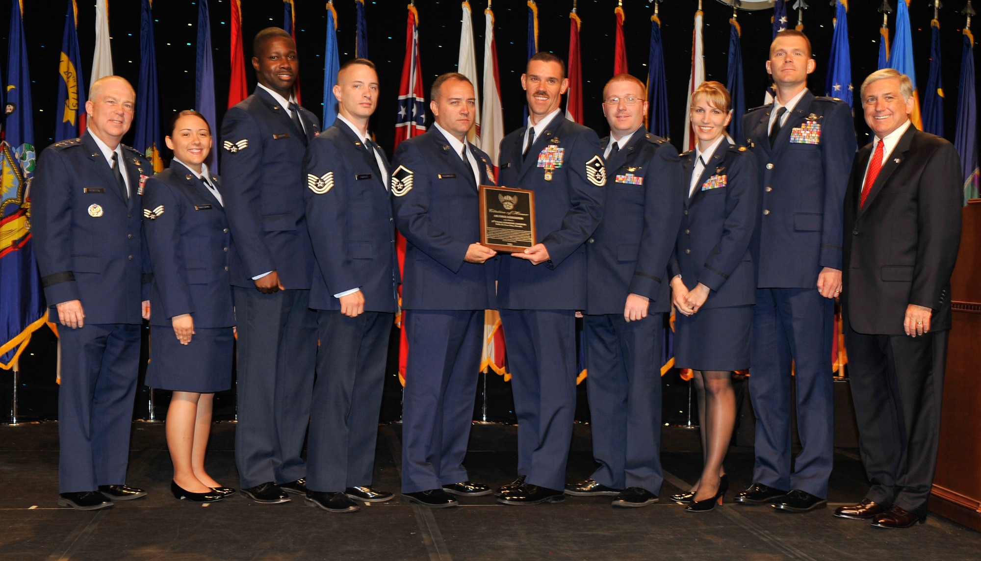 3rd Special Operations Squadron Airmen pose for a photo with AFSOC commander Lt. Gen. Donny Wurster (far left) and AFA Chairman Robert Largent (far right) after being awarded the Citation of Honor at the Air Force Association's 2008 Air and Space Conference and Technology Exposition in Washington, D.C. recently. The Citation of Honor was awarded to the 3rd SOS for its contribution to the development of aerospace power for the betterment of mankind (U.S. Air Force photo by Michael Pausic).