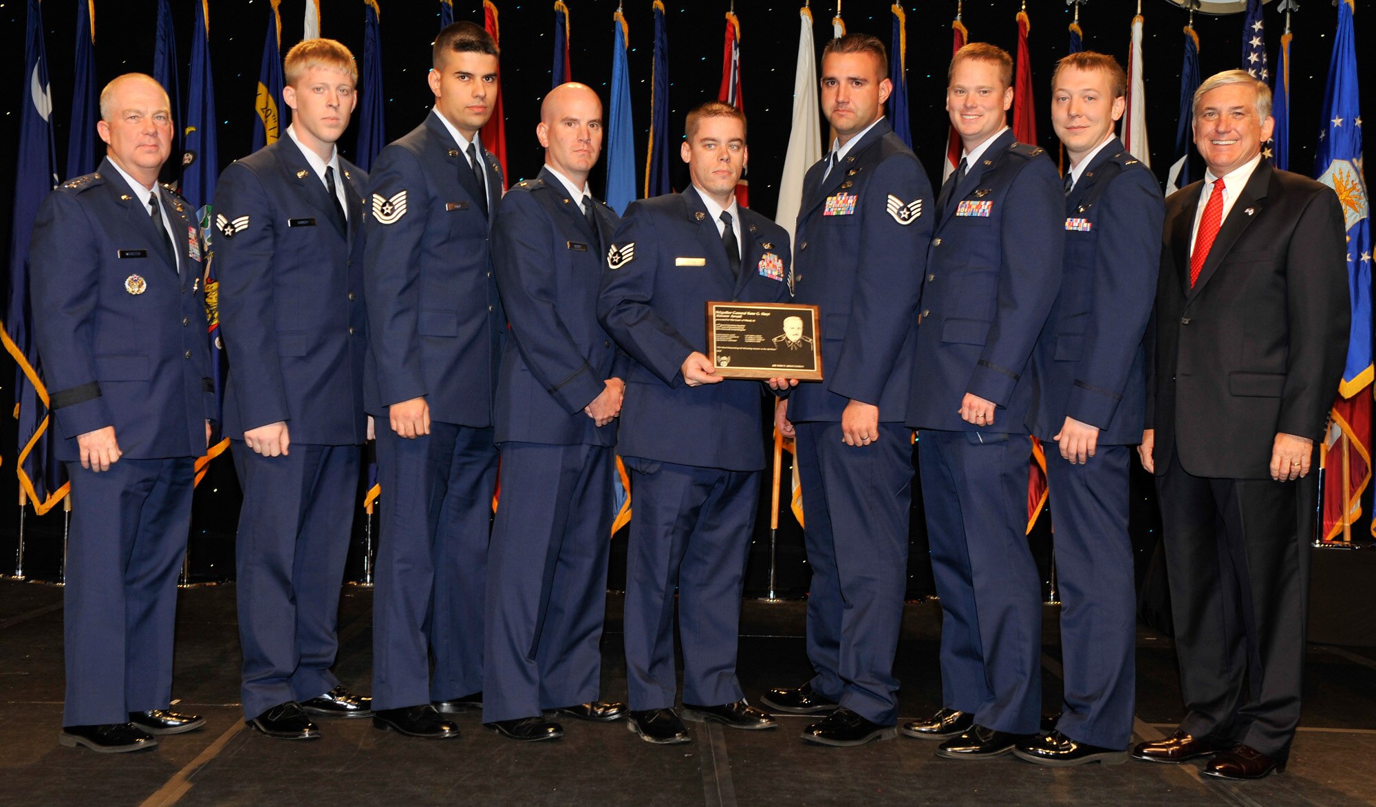 The crew of Woody 26 poses for a photo with AFSOC commander Lt. Gen. Donny Wurster (far left) and AFA Chairman Robert Largent (far right) after being awarded the Brigadier General Ross G. Hoyt Award at the Air Force Association's 2008 Air and Space Conference and Technology Exposition in Washington, D.C. recently. The Hoyt Award is awarded the best air refueling crew in the Air Force. Crew members are with the 67th Special Operations Squadron, 352nd Special Operations Group at RAF Mildenhall (U.S. Air Force photo by Michael Pausic).