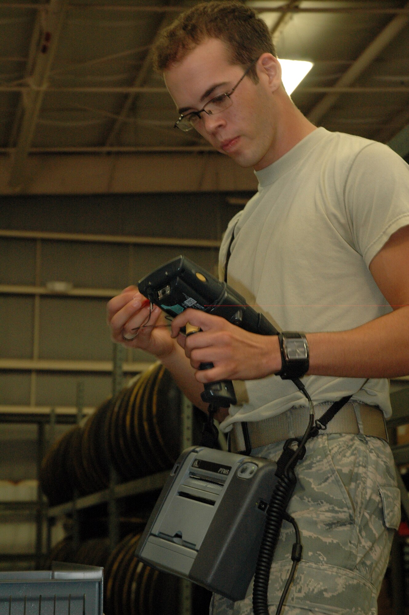 EGLIN AIR FORCE BASE, Fla. -- Airman Carlos Campos-Fernandez, 96th Logisitics Readiness Squadron, material management apprentice, finds an item's warehouse location. Born in Cuba, Airman Campos-Fernandez enjoys the everyday liberties that many citizens take for granted. (US Air Force photo/ Airman 1st Class Anthony Jennings)