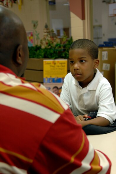 BARKSDALE AIR FORCE BASE, La. - Jaden Jones, 6, a 1st-grader from Waller Elementary School talks with Mahtorhee Bell, youth center sports director, about the upcoming soccer season.  The youth center is now on the Combined Federal Campaign recipient list.  (U.S. Air Force photo by Staff Sgt. Sarah E. Kusek)