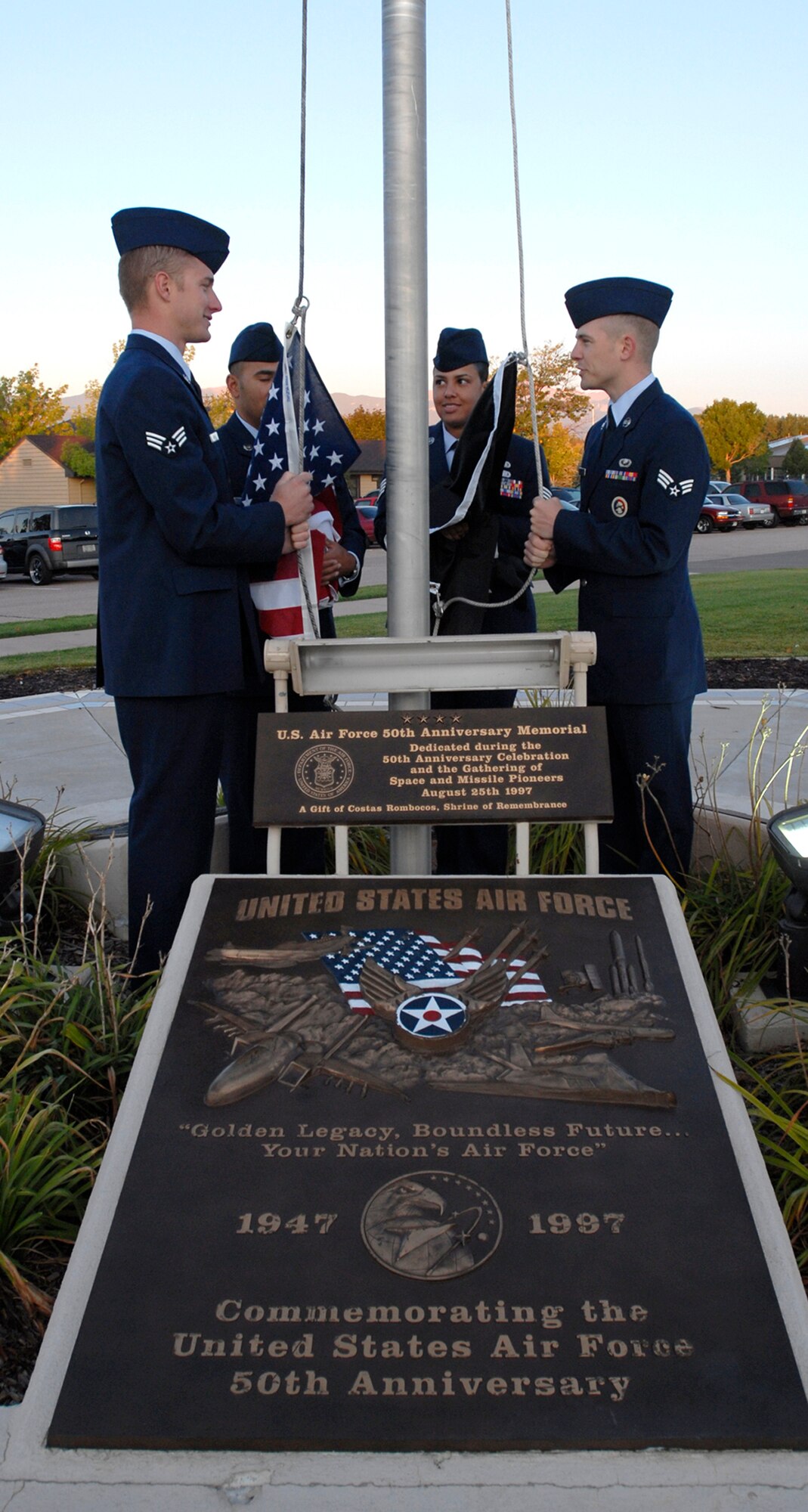 Airmen assigned to Peterson Air Force Base go over last minute details Sept. 15 before reveille at the base's museum in Colorado. The event was used as a forum to inform personnel about POW/MIA Remembrance Week on the base, which ran Sept. 15-19. POW/MIA week allowed members of the installation to remember those held prisoner of war and those missing in action during times of conflict. (U.S. Air Force photo/Craig Denton)