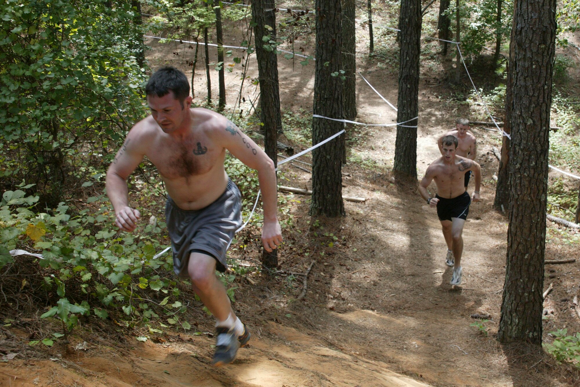 Eastover, S.C.-- Tech. Sgt. Scott Ackeret, Senior Airmen Trevor Brown and Michael Pasley, and Senior Master Sgt. Jason Hines, Shaw Air Force Base Explosive Ordnance Disposal team members, run up-hill during the first portion of the 15th Annual U.S. Marine Corps Ultimate Challenge Mud Run at the USMC Reserve Center Sept. 20. The team ran the 4.2 mile challenge in 50 minutes and 12 seconds, placing 101st out of approximately 1,200 teams and 9th out of the 53 military teams. 