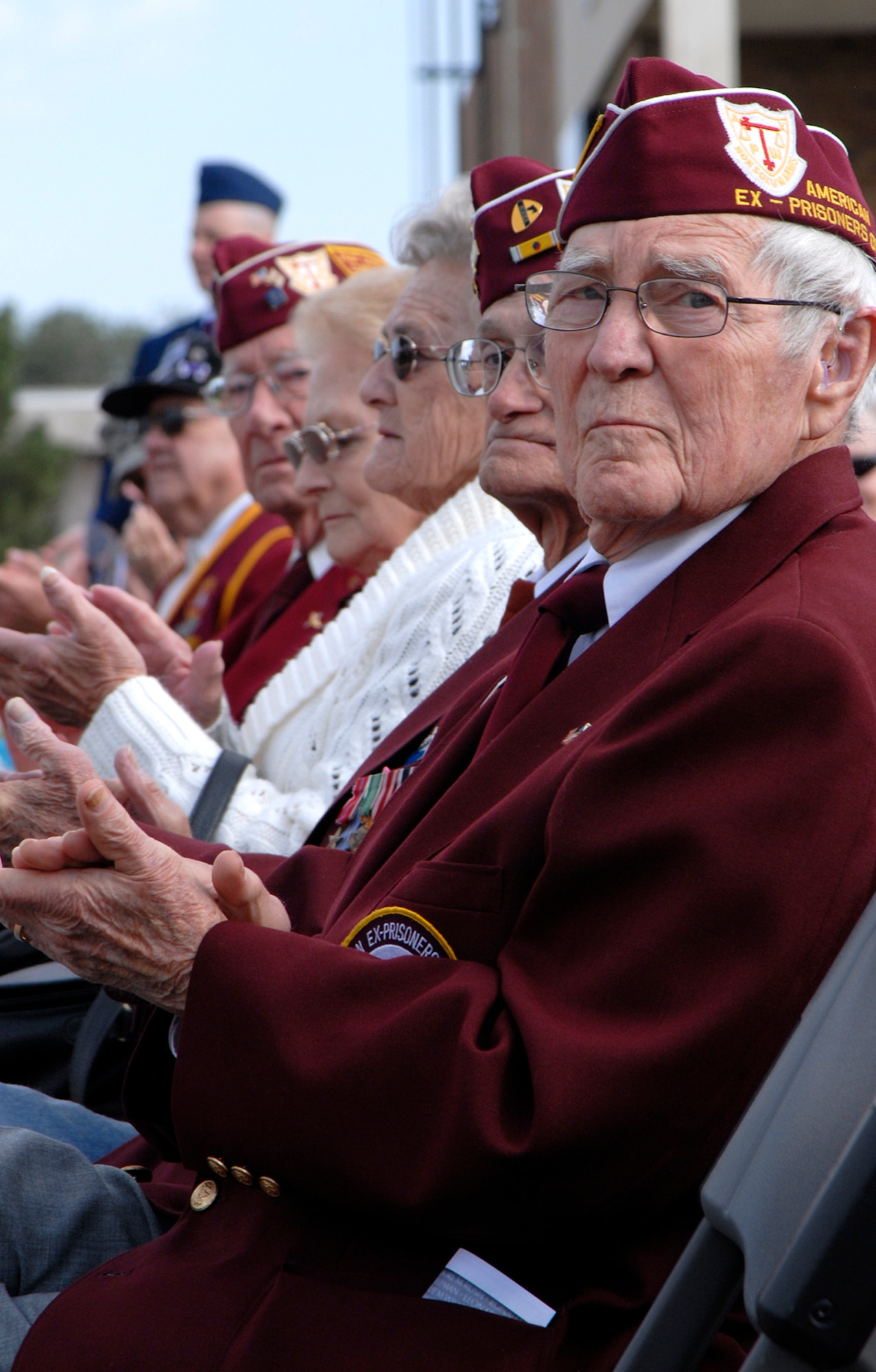 Former American POWs show their appreciation to base personnel Sept. 19 during the POW/MIA Remembrance Ceremony held at the Peterson Air Force Base chapel in Colorado. The event was used as a forum to inform personnel about POW/MIA Remembrance Week on the base, which ran Sept. 15-19. POW/MIA week allowed members of the installation to remember those held prisoner of war and those missing in action during times of conflict. (U.S. Air Force photo/Craig Denton) 