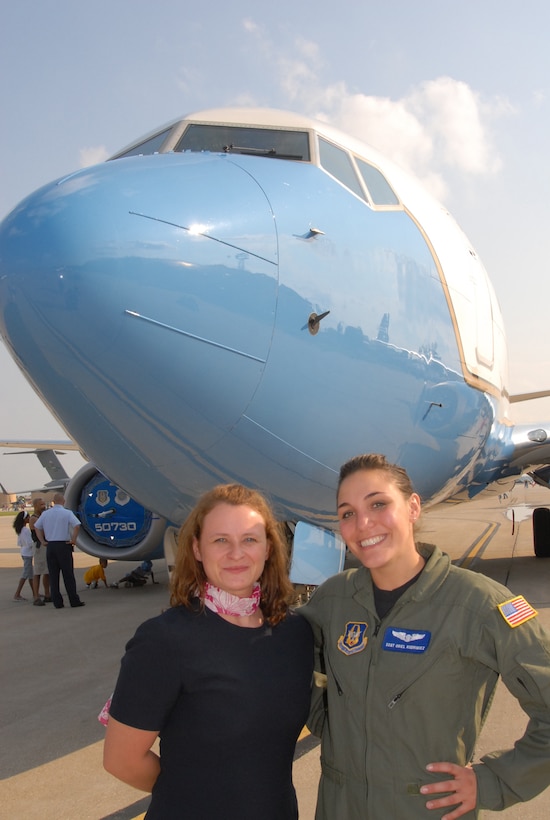 The 932nd Airlift Wing participated in the wonderful Airshow 2008 at Scott Air Force Base, Ill.  Flight attendants Staff Sgt. Andrea Korobey and Staff Sgt. Oriel Rodriguez stand before the nose of the newest C-40C aircraft during the static display events.  They were on hand along with pilots to talk about the Air Force Reserve Command distinguished flying mission.  (U.S. photo by Maj. Stan Paregien)