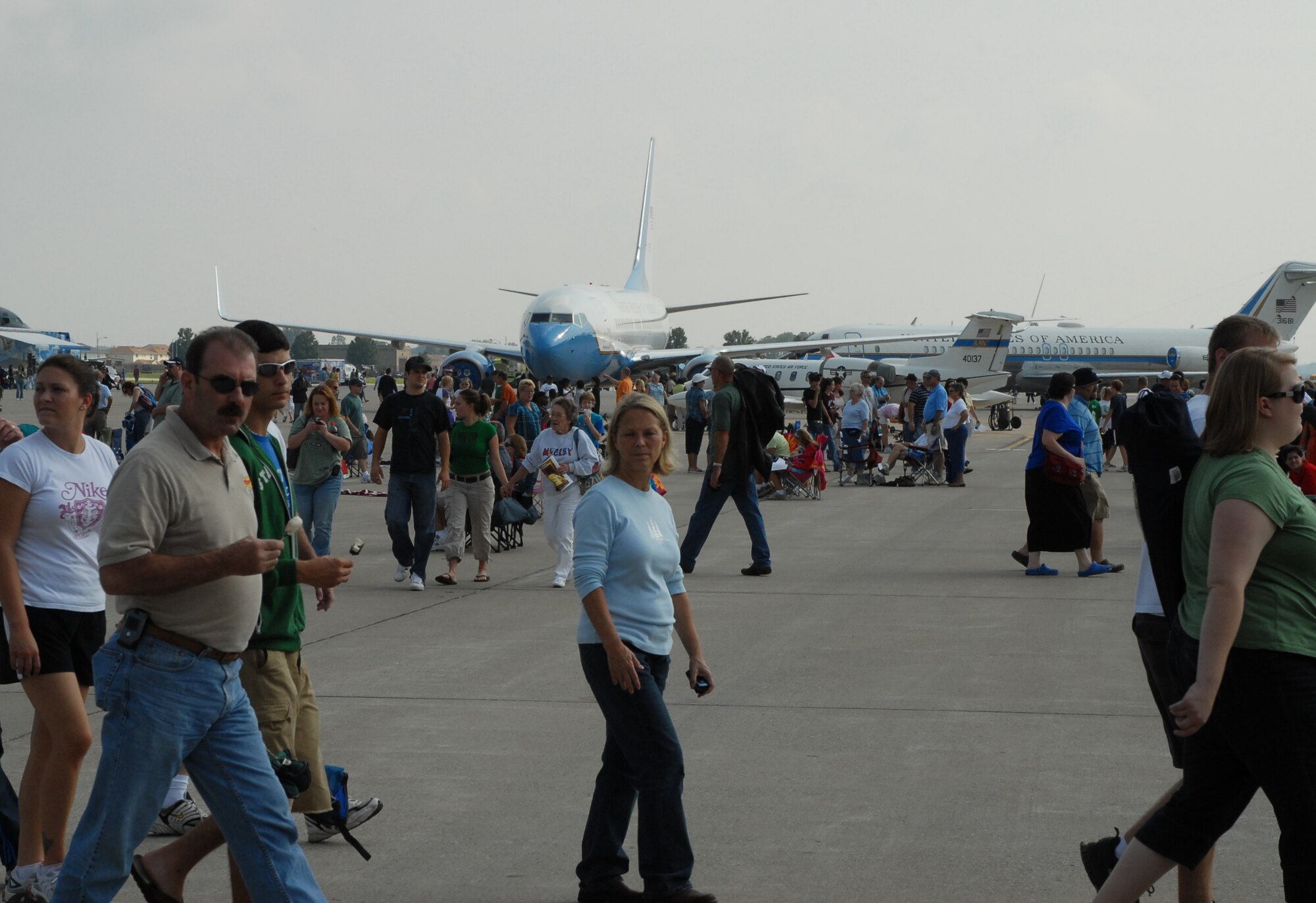 The 932nd Airlift Wing C-40C plane is almost covered by the large crowd that came out to Scott Air Force Base to see the 2008 Airpower Over the Midwest Air Show.  It featured the Air Force's premier demonstration team, the Thunderbirds, the U.S. Special Operations Command parachute demo team, an F-15 demo flown by West Plains, Mo., native Capt. Sam Joplin, and the Trojan Horsemen among a variety of other vintage and modern military aircraft like the Air Force Reserve Command's C-40C (center) and C-9C (right). 
