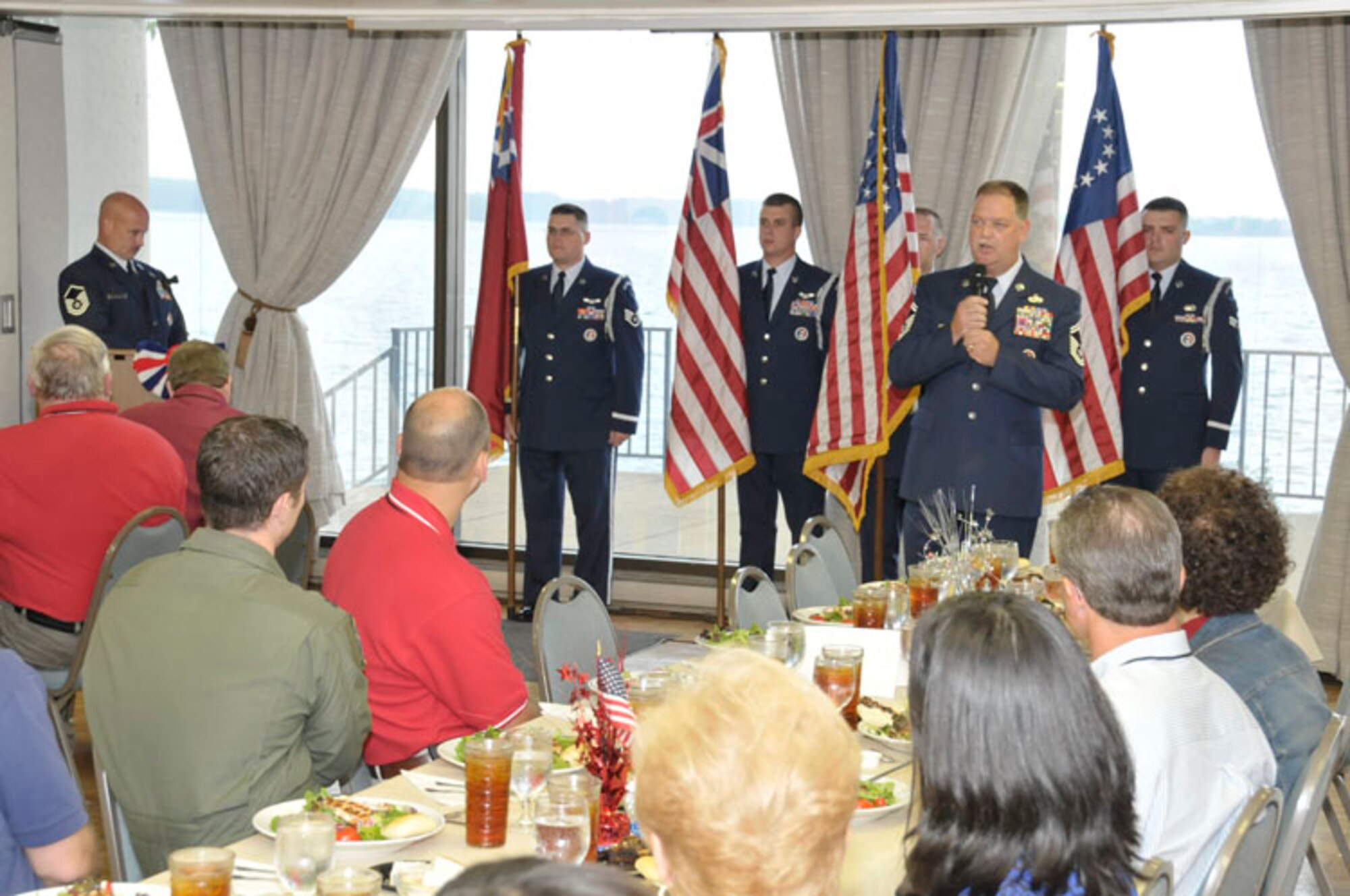 Tennessee Air National Guard members from the 118th Airlift Wing demonstrate Operation Patriotism to the Little Rock civic leader group. During the ceremony, the history of the American flag is explained and it encourages a sense of patriotism. (Photo by Rick Goodfriend)