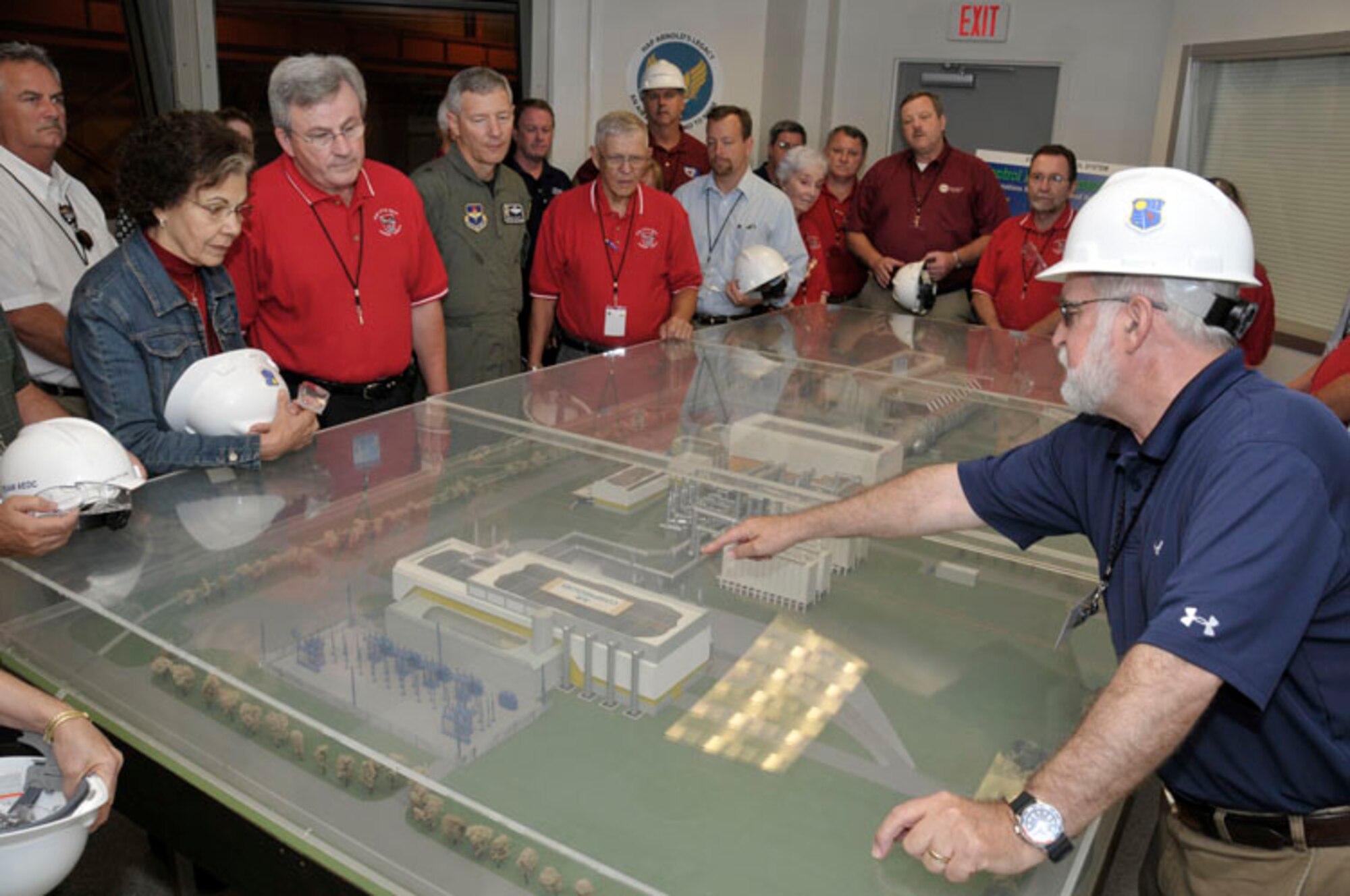Claude Morse, Aerospace Testing Alliance Public Affairs Manager, explains the role of the Aeropropulsion Systems Test Facility to the Little Rock AFB civic leaders. (Photo by Rick Goodfriend)