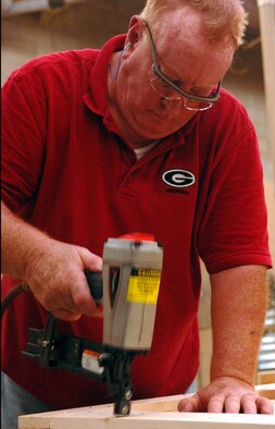 MOODY AIR FORCE BASE, Ga. – Steve Garren, 23rd Logistics Readiness Squadron wood worker, inserts nails into a crate top here Sept 15. The LRS traffic management office is responsible for all packages that come on and off of base. (U.S. Air Force photo by Airman Joshua Green)  

