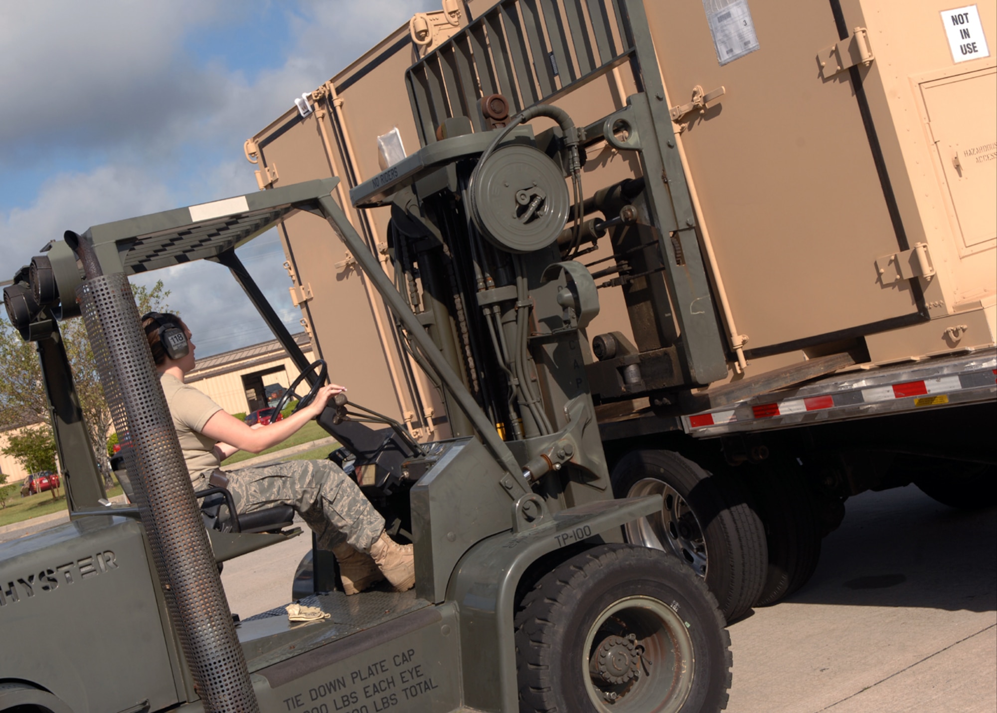 MOODY AIR FORCE BASE, Ga. – Senior Airman Rebecca List, 23rd Logistics Readiness Squadron traffic management office inbound cargo supervisor, lifts a metal storage bin with a 10K forklift here Sept. 15. One of the 23rd LRS’s jobs is to ensure any piece of equipment that moves though their dock is properly checked and identified.. (U.S. Air Force photo by Airman Joshua Green)  