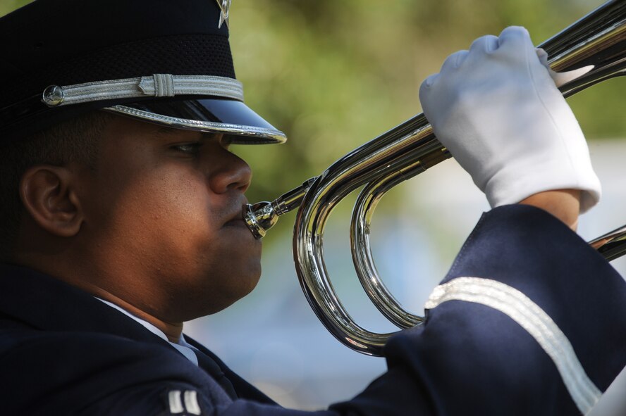 MOODY AIR FORCE BASE, Ga. – Moody Honor Guard member Airman 1st Class Jonathan Bourgeois plays taps during the National Prisoner of War/Missing in Action Remembrance Day ceremony here Sept. 19. Team Moody gathered to pay their respects to brave Americans who were held as prisoners of war and to those who are still missing in action. (U.S. Air Force photo by Senior Airman Gina Chiaverotti)