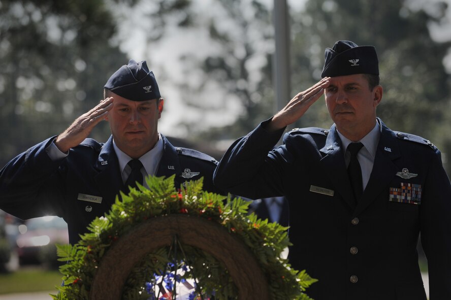 MOODY AIR FORCE BASE, Ga. – Col. Henry Santicola, 23rd Wing vice commander, and Col. Thomas Webster, 93rd Air Ground Operations Wing acting vice commander, pay their respects to the men and women of the armed forces who have been prisoners of war or missing in action during the National Prisoner of War/Missing in Action Remembrance Day ceremony here Sept. 19. (U.S. Air Force photo by Senior Airman Gina Chiaverotti)