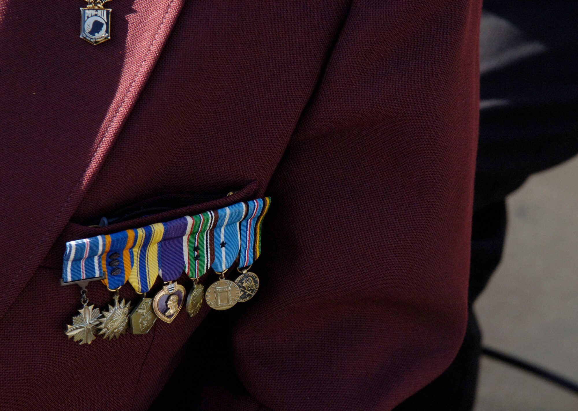 LANGLEY AIR FORCE BASE, Va. -- A Purple Heart, grouped with other medals, is shown on the jacket of retired Lt. Col. Wayne Porter. Mr. Porter is a World War II veteran of the Army Air Corps. He was shot down over Munich, Germany on Oct. 4, 1944, and liberated on April 29, 1945. He currently serves as the adjutant for the James L. Hale Memorial Chapter of the American Ex-Prisoners of War Organization. (U.S. Air Force photo/Airman Rebecca Montez)